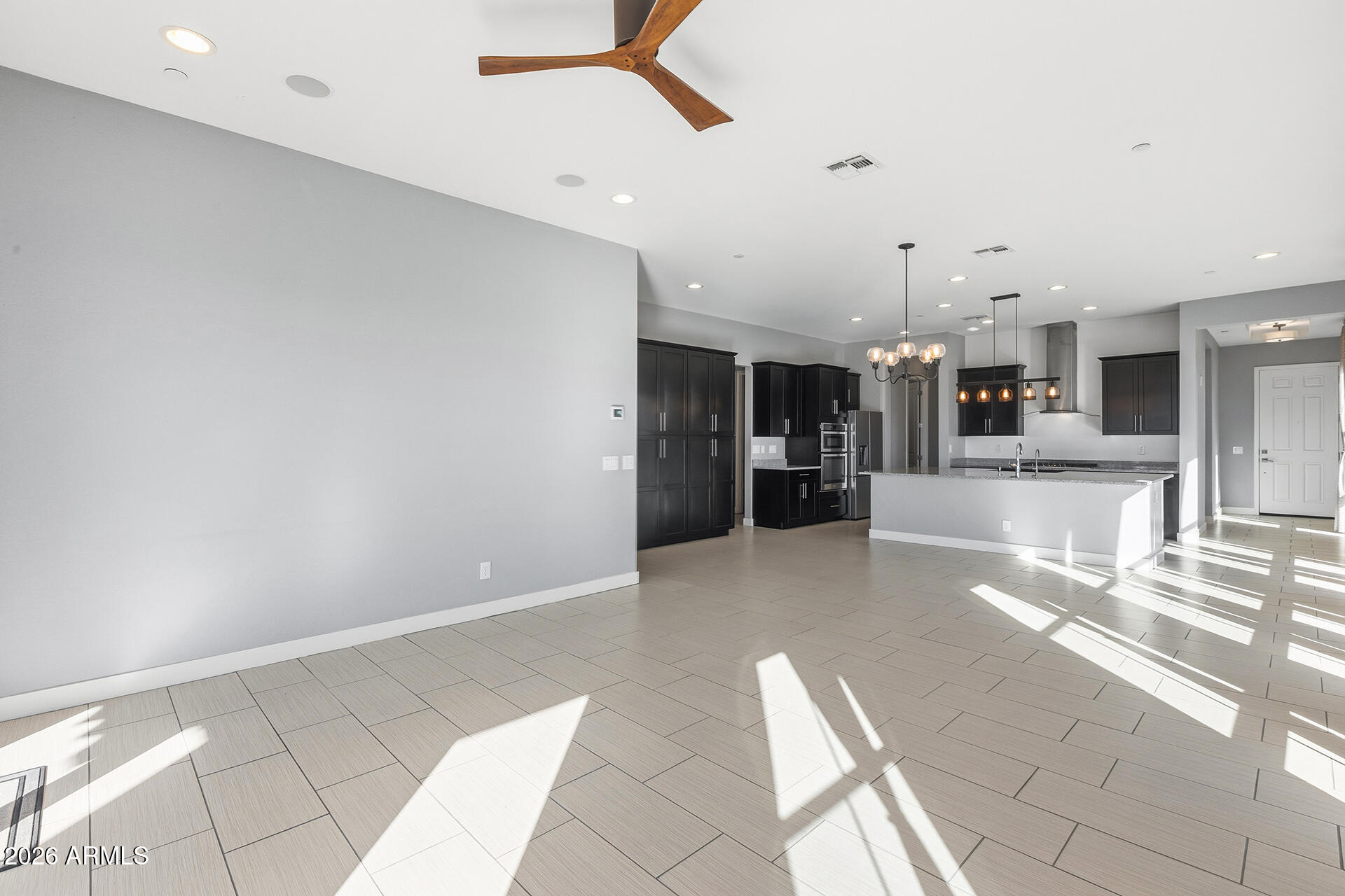 12035 West Roy Rogers Road Peoria, AZ 85383 - Photo 26 of 46 a view of a living room and kitchen