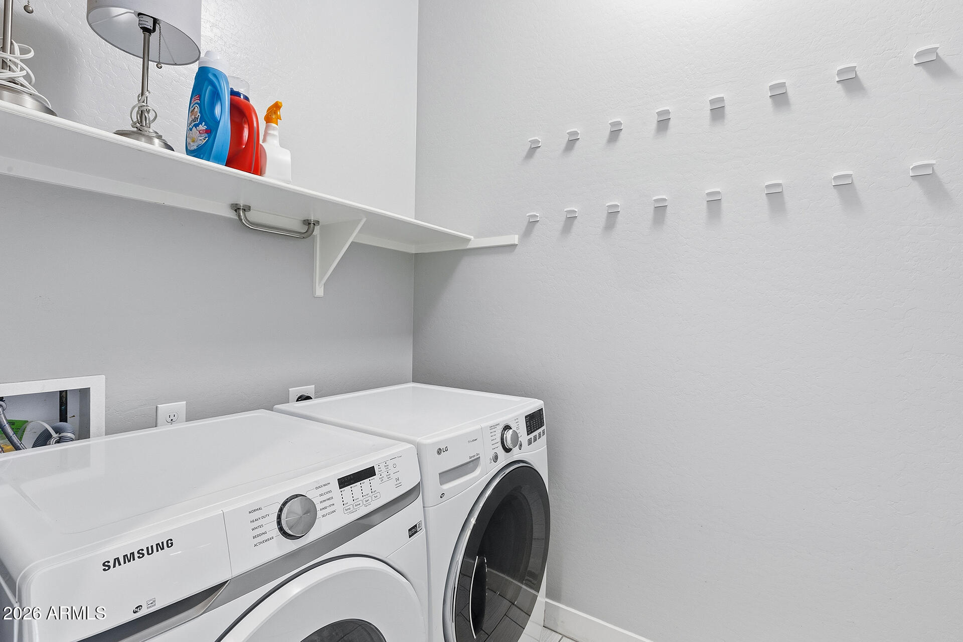 12035 West Roy Rogers Road Peoria, AZ 85383 - Photo 27 of 46 a utility room with dryer and washer