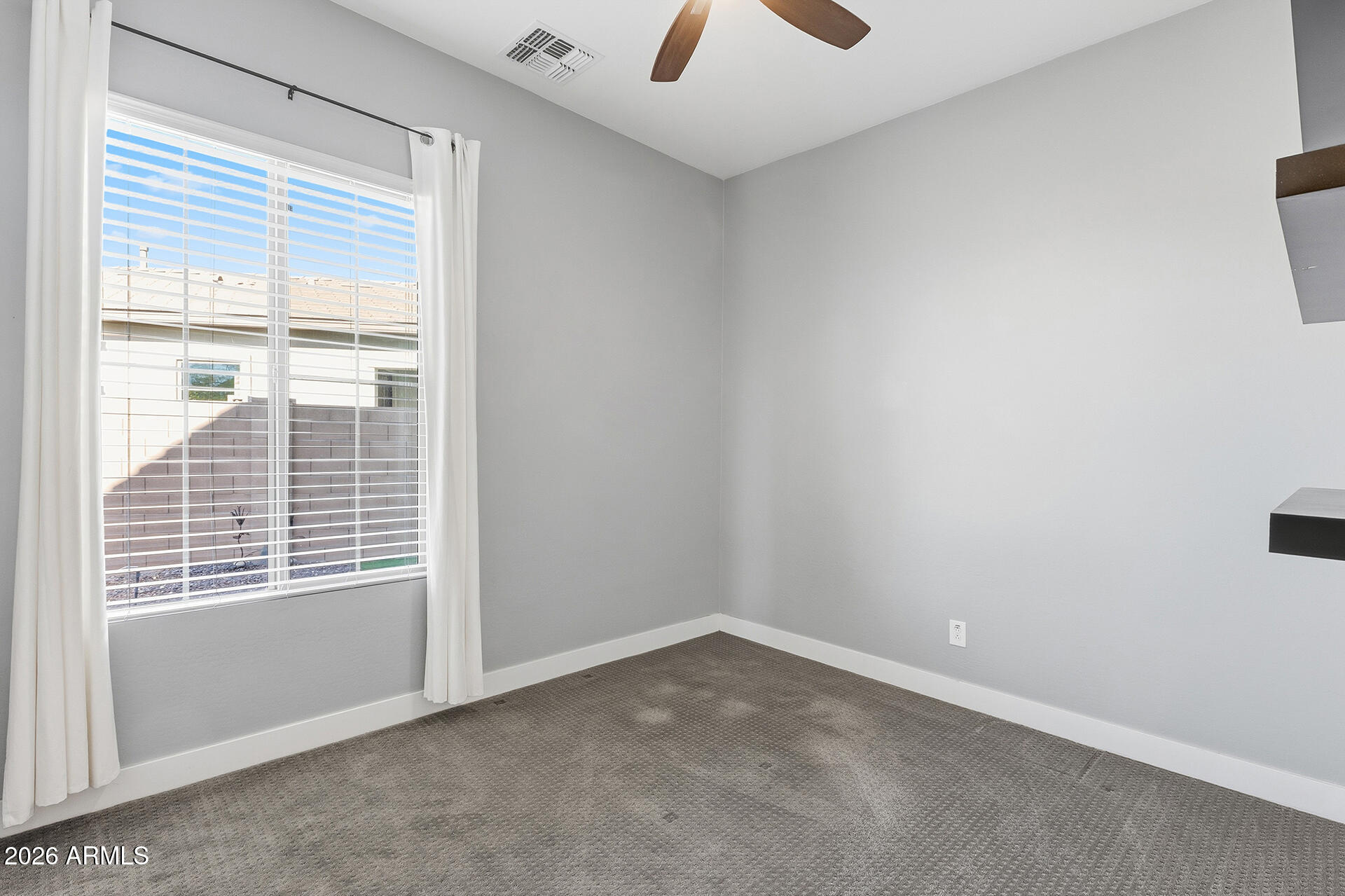 12035 West Roy Rogers Road Peoria, AZ 85383 - Photo 29 of 46 a view of an empty room with a window
