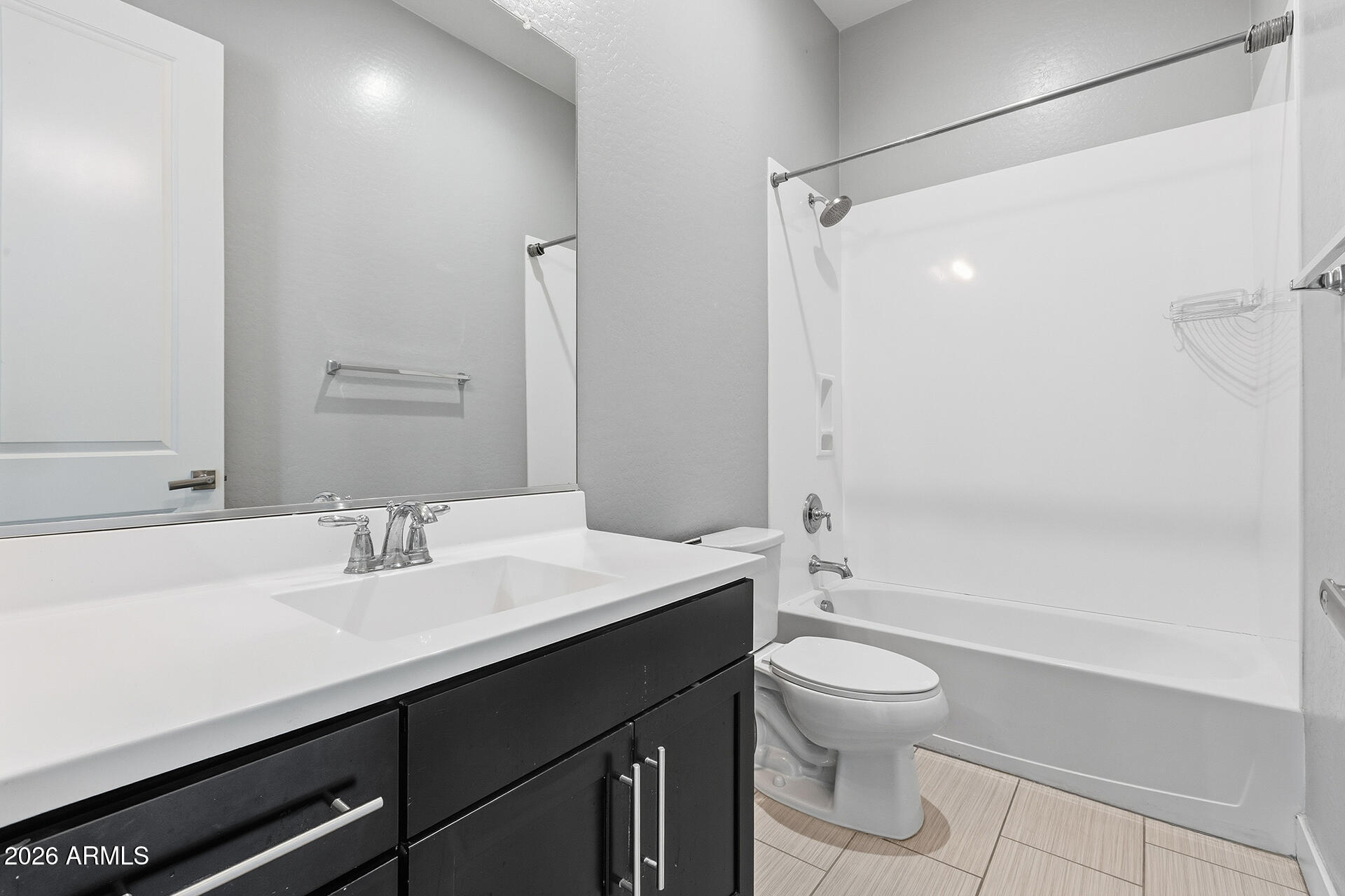 12035 West Roy Rogers Road Peoria, AZ 85383 - Photo 31 of 46 a bathroom with a sink a toilet and shower