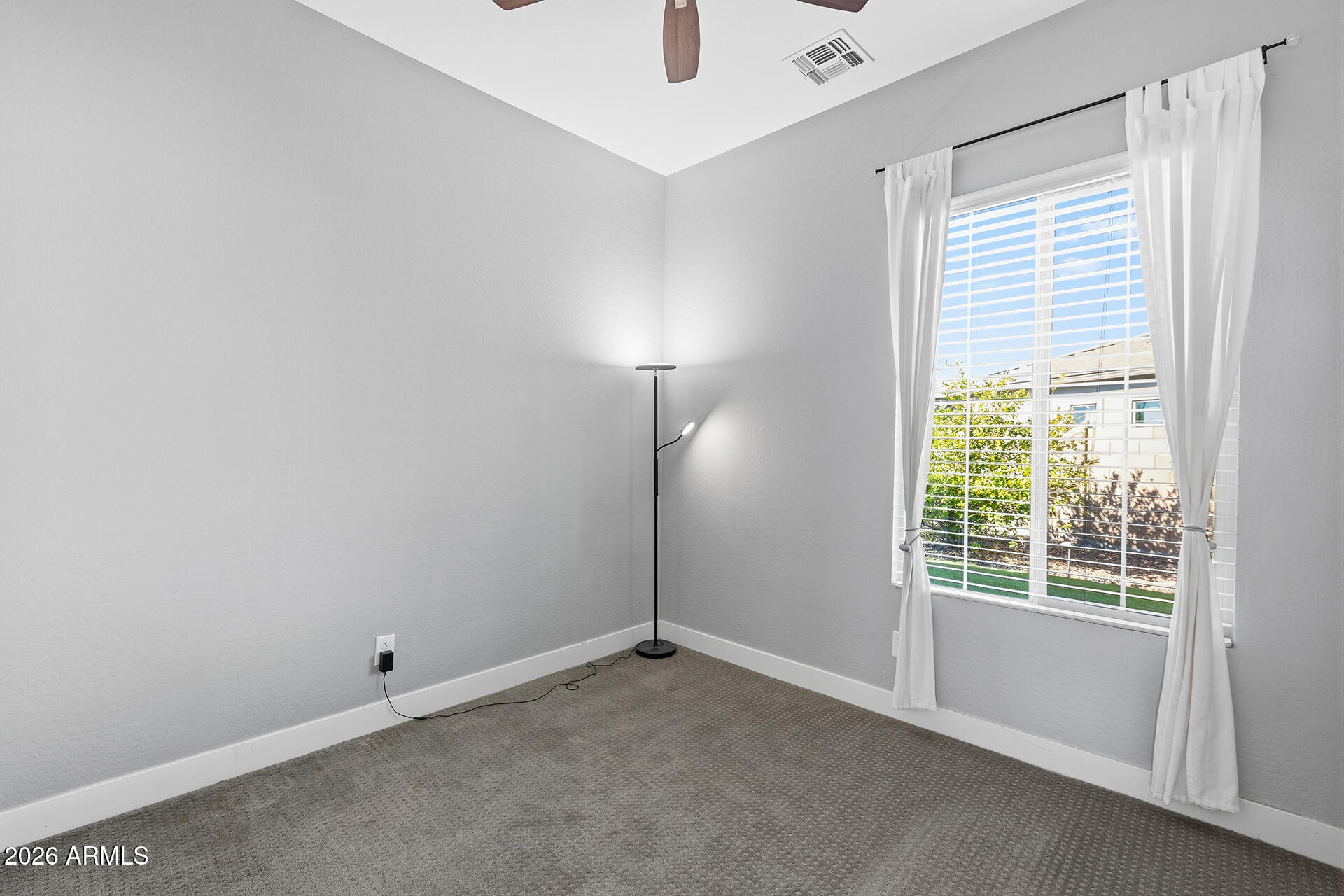 12035 West Roy Rogers Road Peoria, AZ 85383 - Photo 32 of 46 a view of an empty room with a window