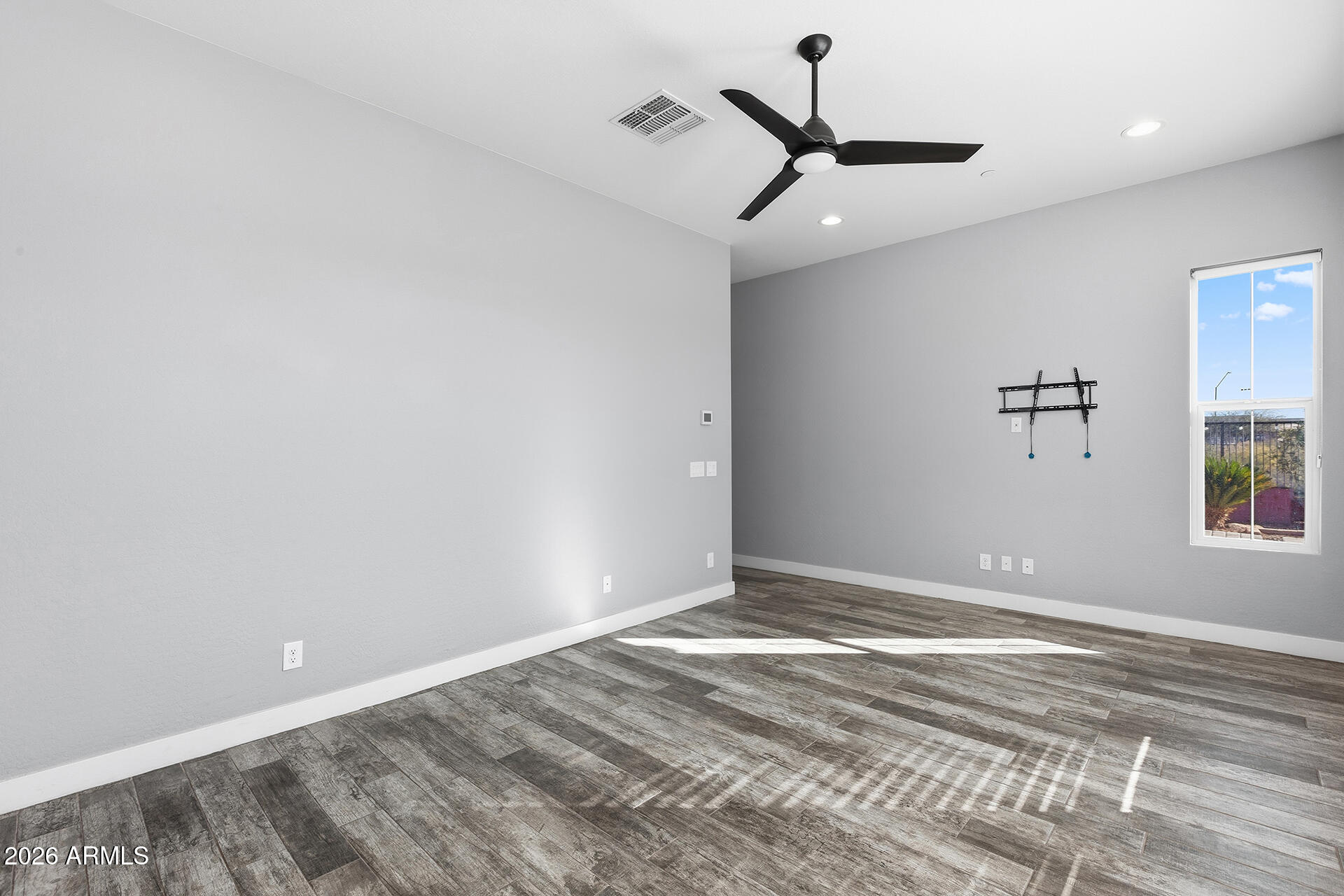 12035 West Roy Rogers Road Peoria, AZ 85383 - Photo 36 of 46 a view of a room with a ceiling fan and window