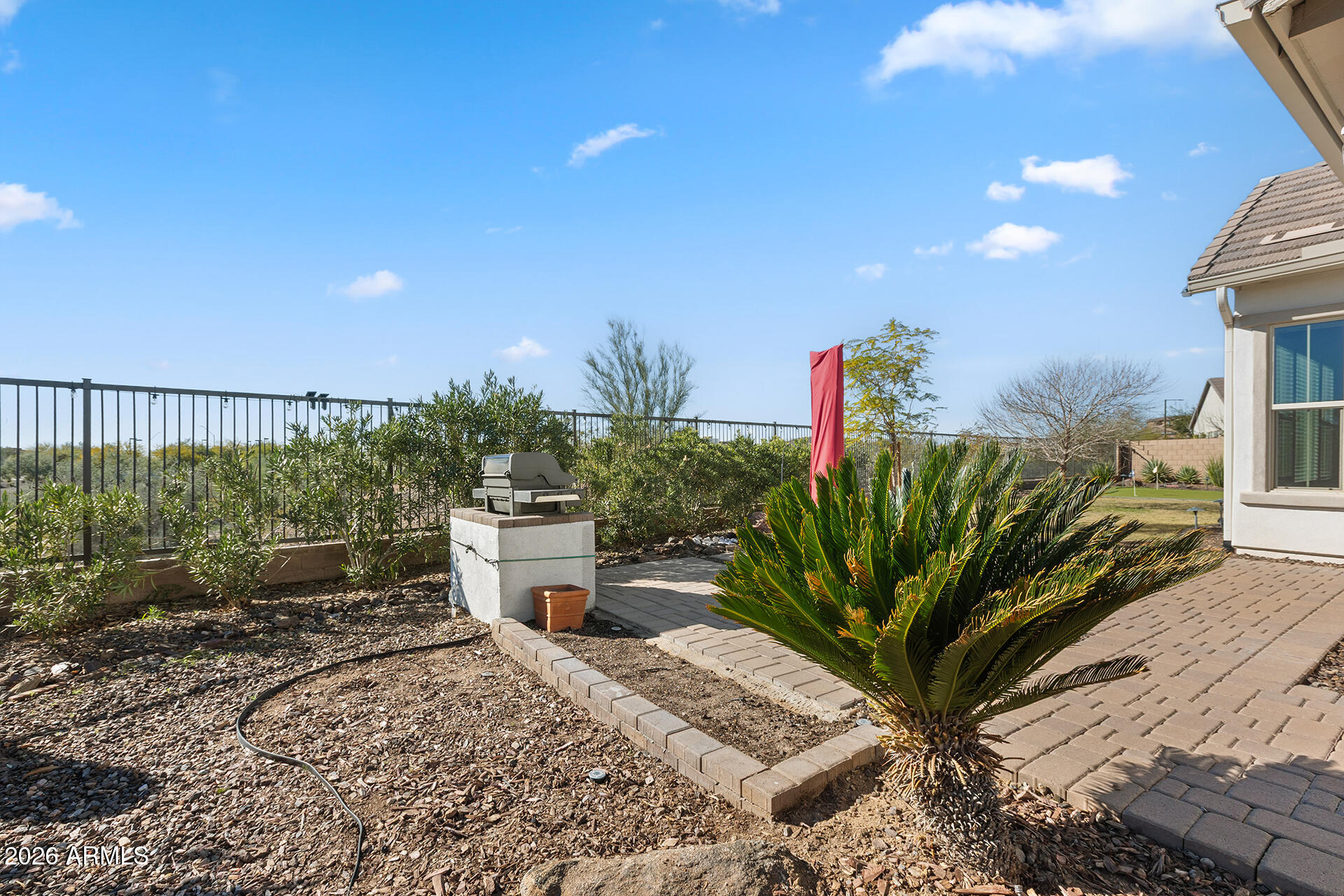 12035 West Roy Rogers Road Peoria, AZ 85383 - Photo 40 of 46 a view of a backyard with plants and outdoor seating