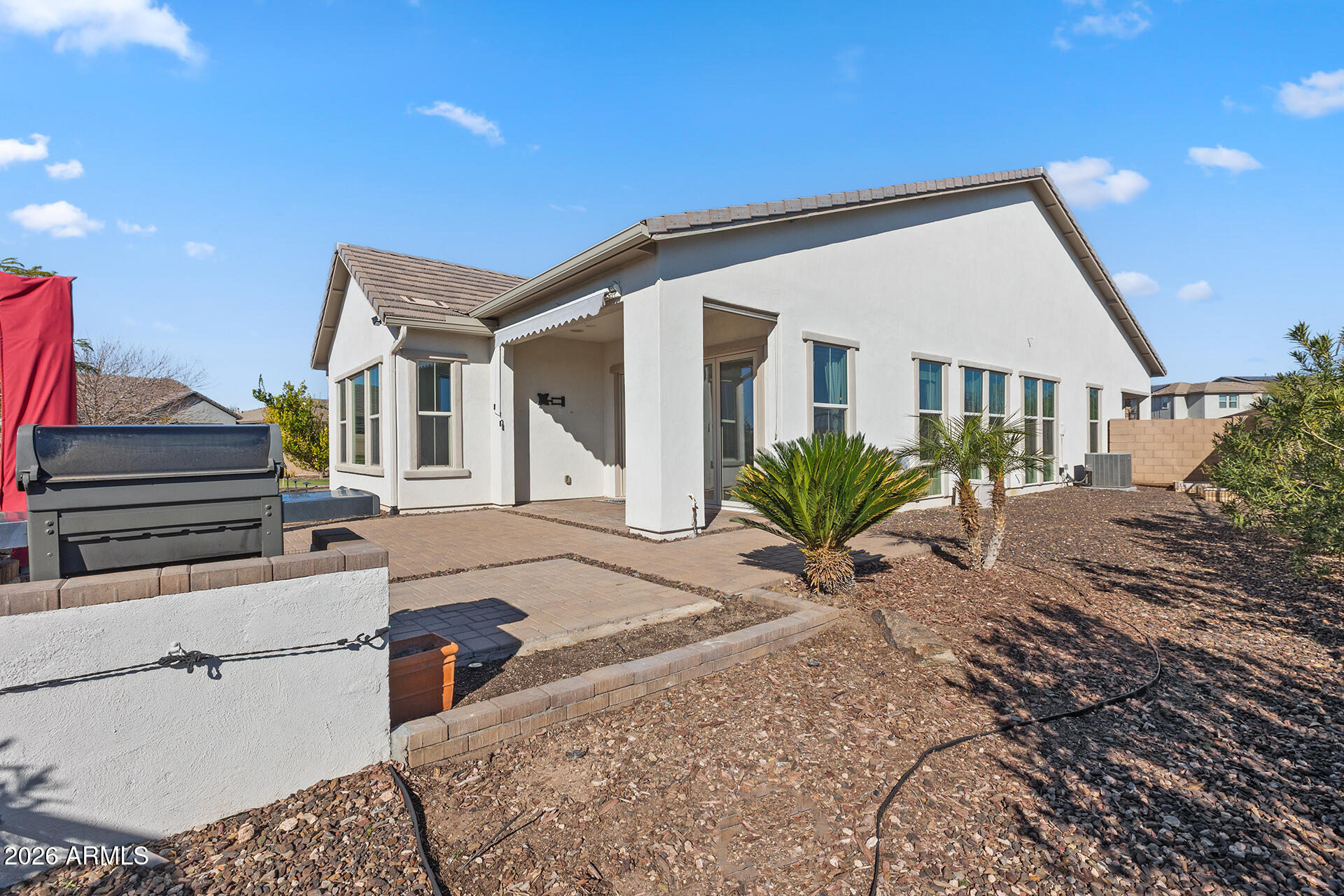12035 West Roy Rogers Road Peoria, AZ 85383 - Photo 41 of 46 a view of a house with a patio
