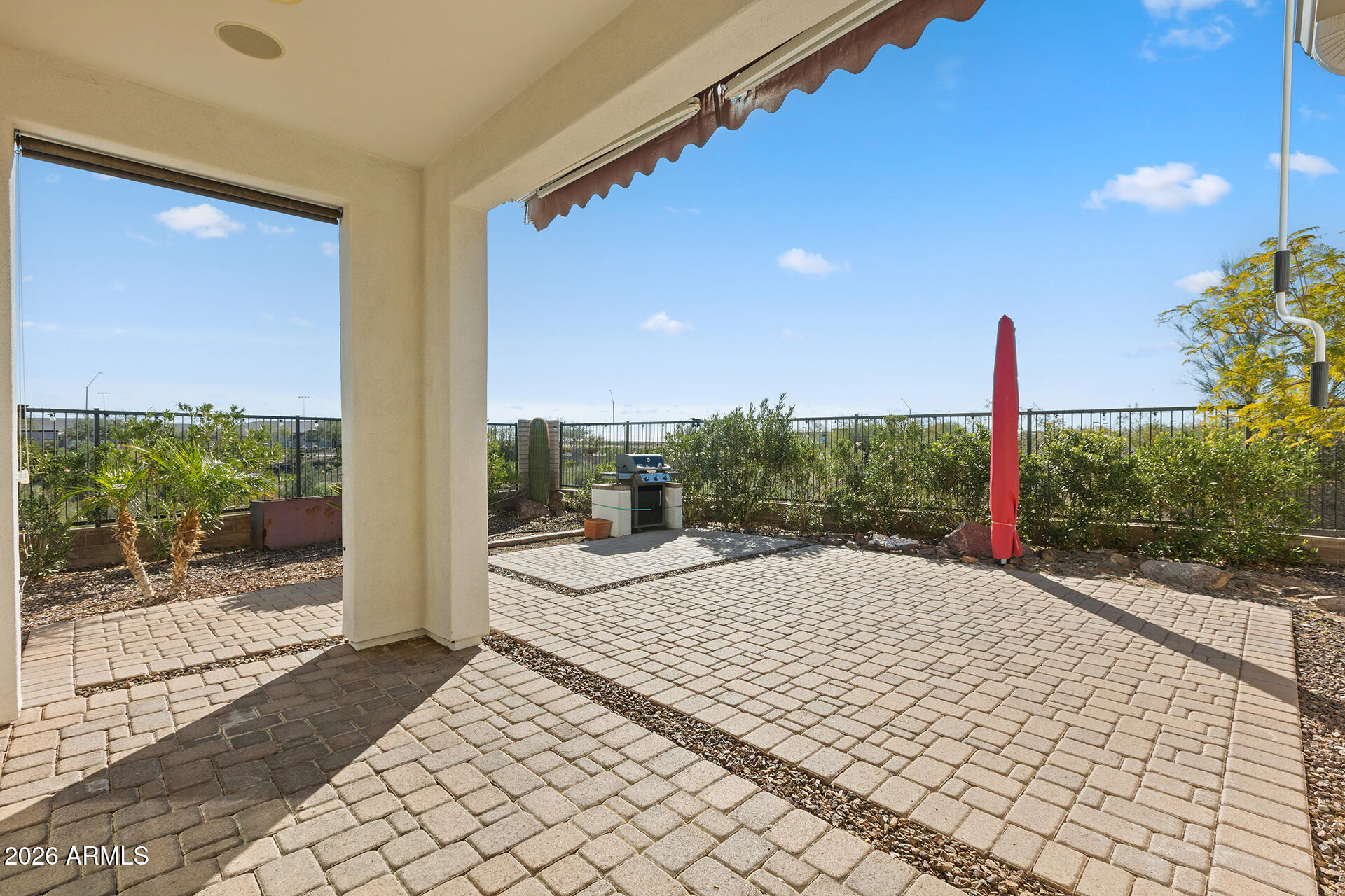 12035 West Roy Rogers Road Peoria, AZ 85383 - Photo 5 of 46 a very nice looking house with a big yard and potted plants