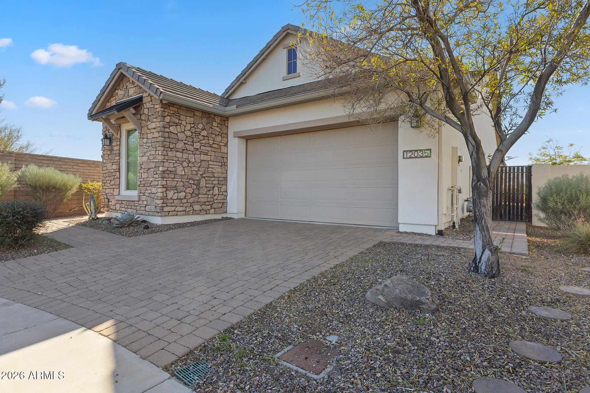 12035 West Roy Rogers Road Peoria, AZ 85383 - Photo 7 of 46 a front view of a house with a yard
