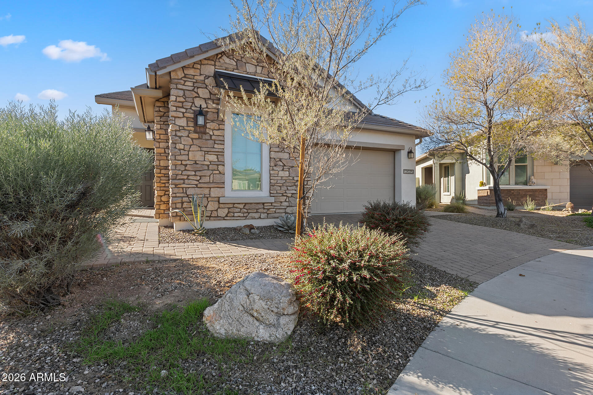 12035 West Roy Rogers Road Peoria, AZ 85383 - Photo 9 of 46 a front view of a house with a yard