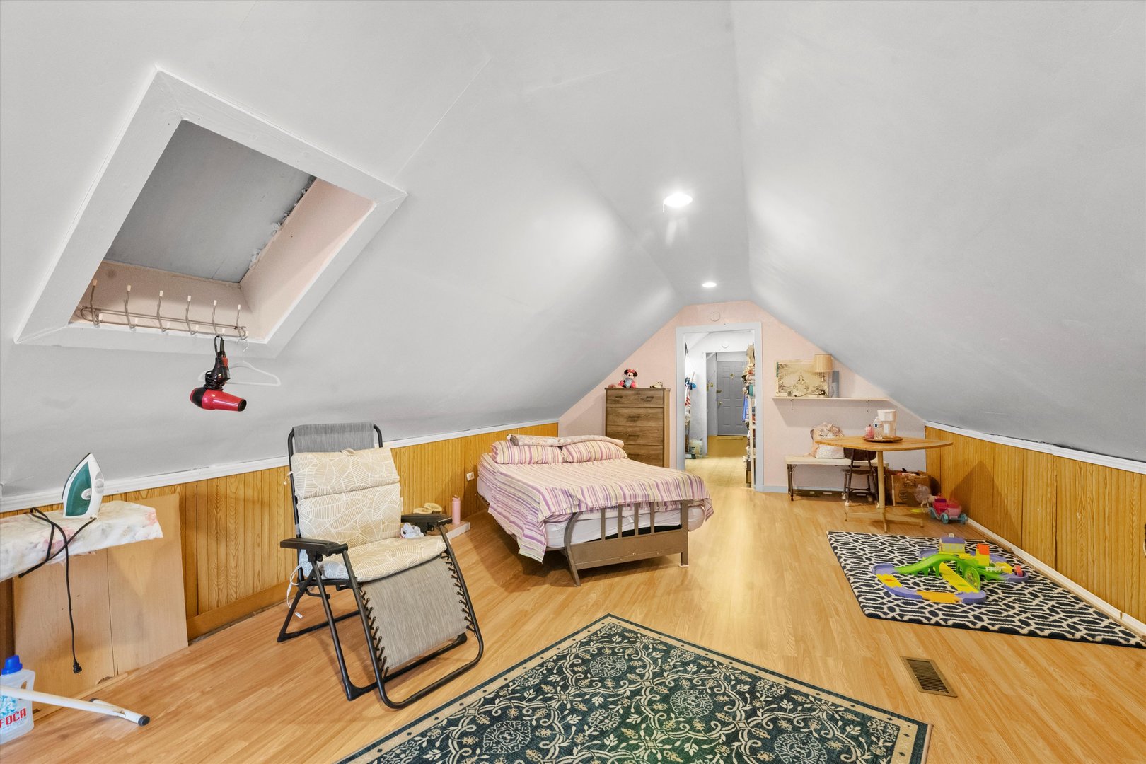 2129 West 18th Place Chicago, IL 60608 - Photo 11 of 38 a spacious bedroom with a bed and a dresser