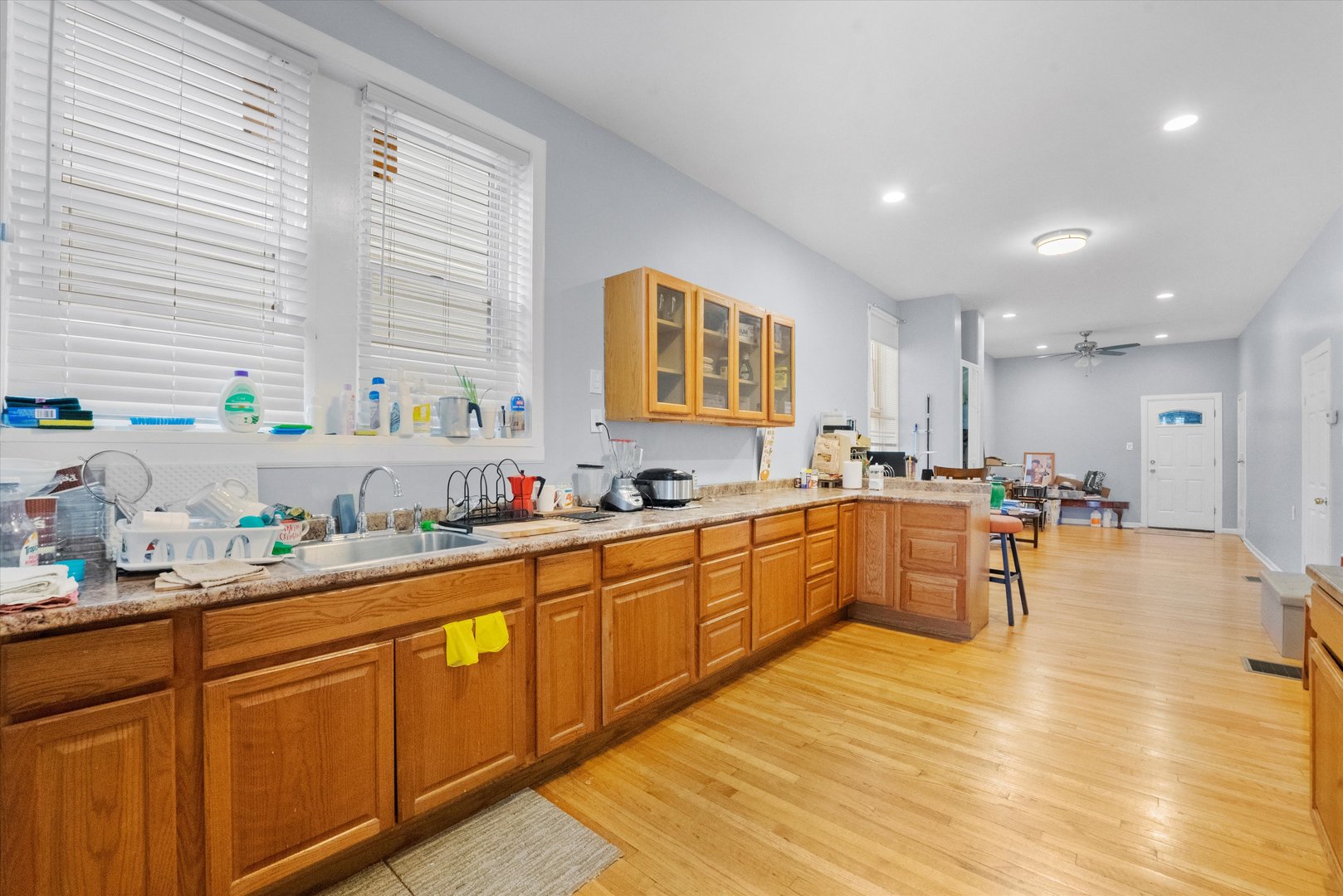 2129 West 18th Place Chicago, IL 60608 - Photo 16 of 38 a kitchen with stainless steel appliances granite countertop a sink counter space and a window