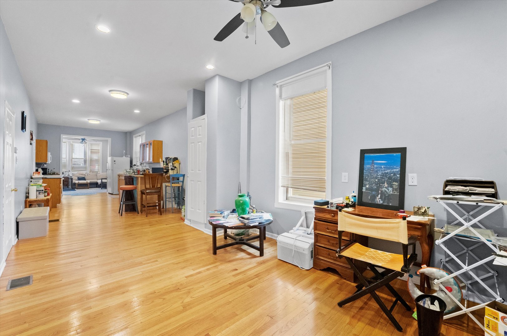 2129 West 18th Place Chicago, IL 60608 - Photo 18 of 38 a living room with furniture and kitchen view