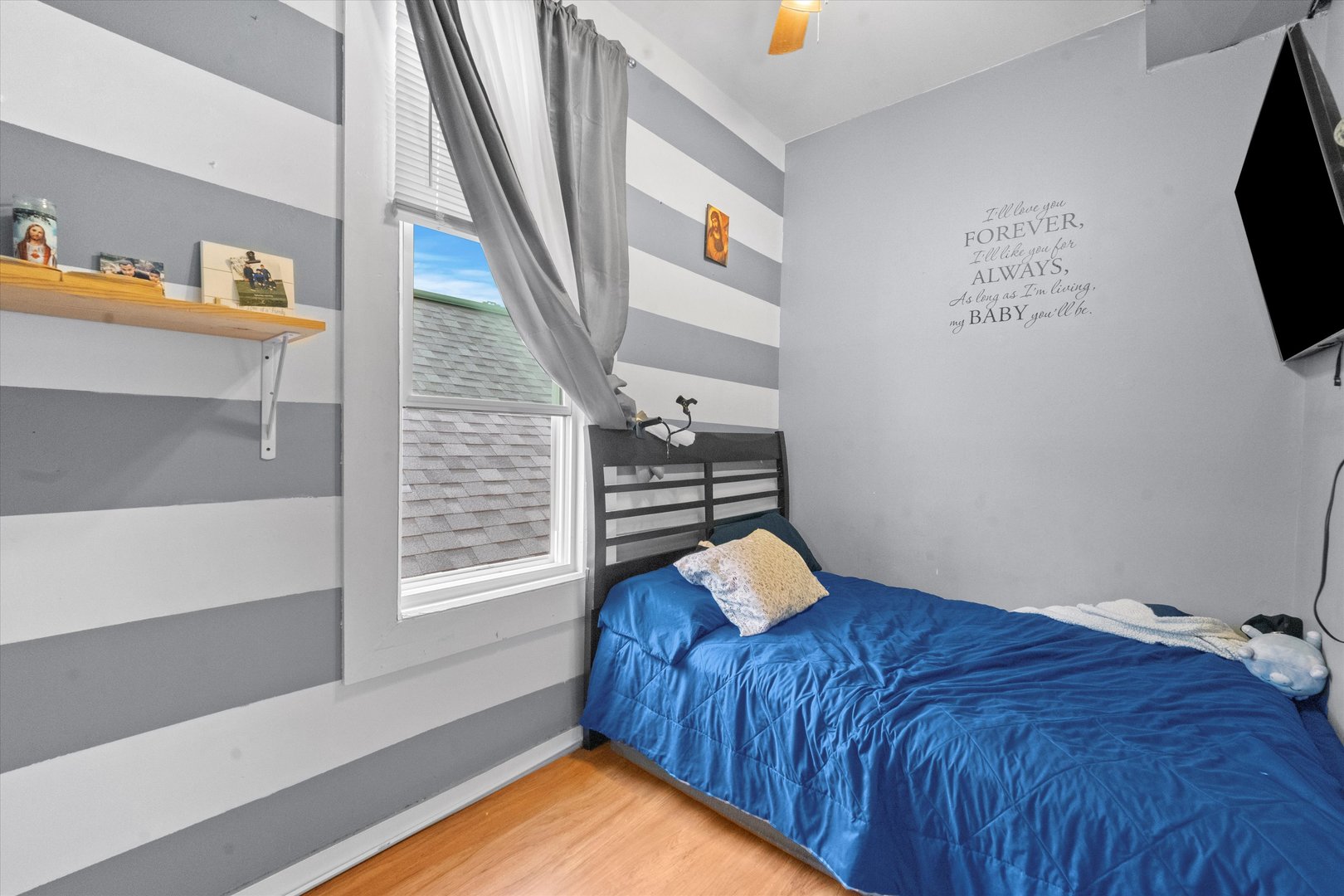 2129 West 18th Place Chicago, IL 60608 - Photo 27 of 38 a view of a bedroom with wooden floor and staircase