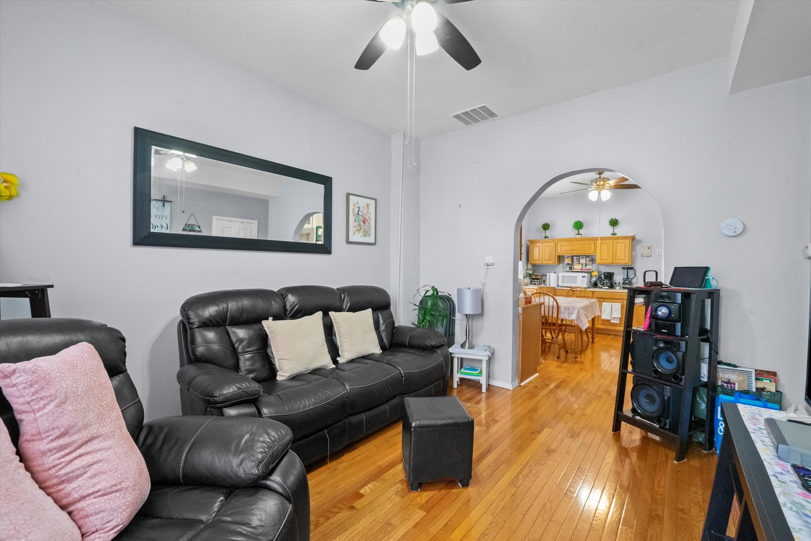 2129 West 18th Place Chicago, IL 60608 - Photo 4 of 38 a living room with furniture and a wooden floor