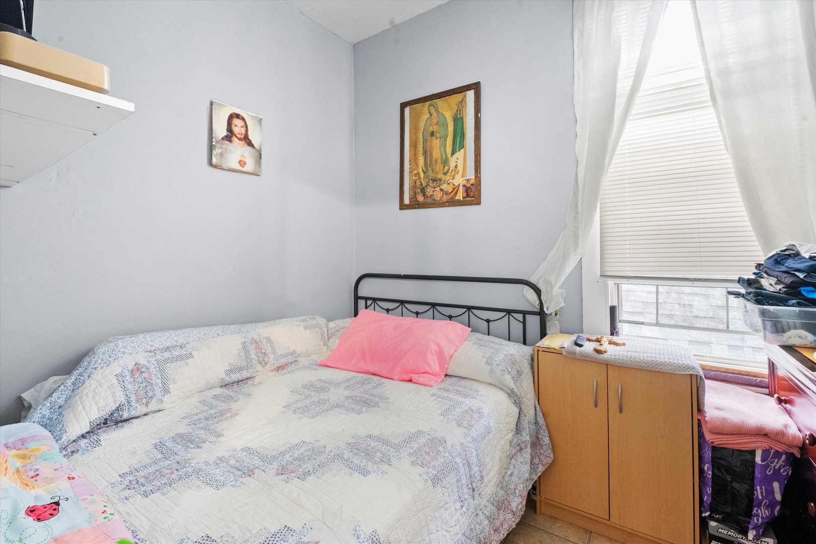 2129 West 18th Place Chicago, IL 60608 - Photo 8 of 38 a bedroom with a bed and a window