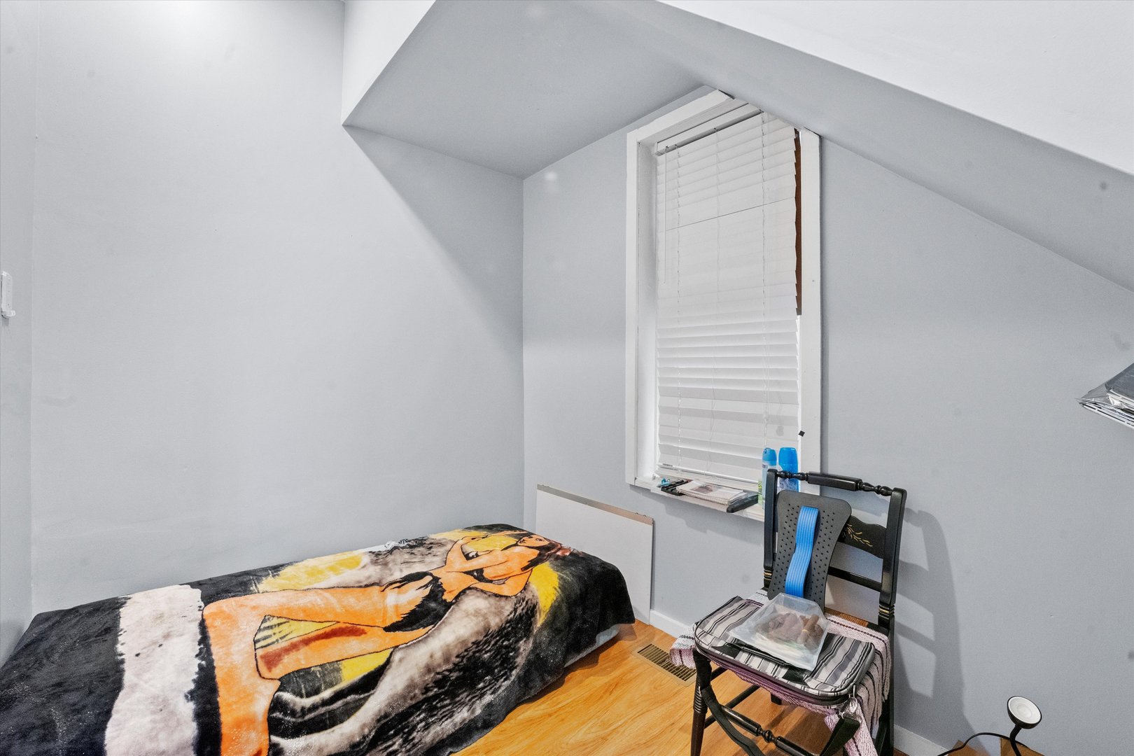 2129 West 18th Place Chicago, IL 60608 - Photo 9 of 38 a bedroom with a bed and a window