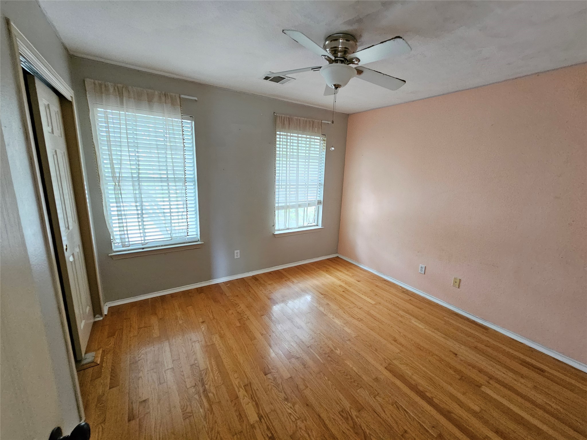 4672 Mather Kyle, TX 78640 - Photo 20 of 28 an empty room with wooden floor and windows