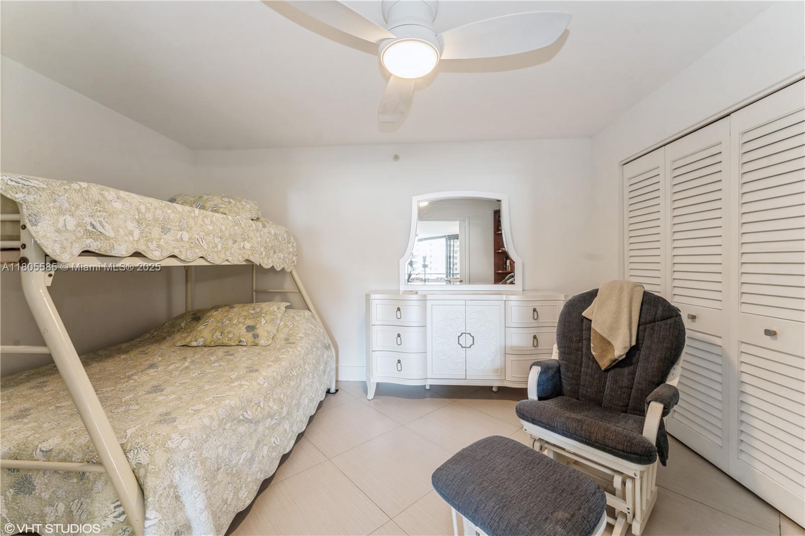 170 Ocean Ln Drive, Unit 906 Key Biscayne, FL 33149 - Photo 11 of 26 a bedroom with a bed chair and window
