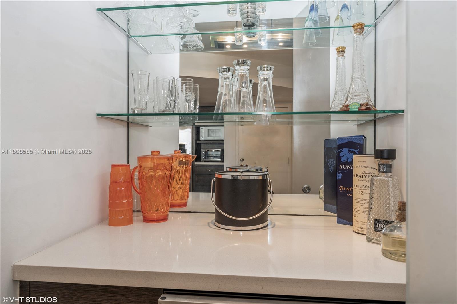 170 Ocean Ln Drive, Unit 906 Key Biscayne, FL 33149 - Photo 14 of 26 a kitchen with a refrigerator and cabinets