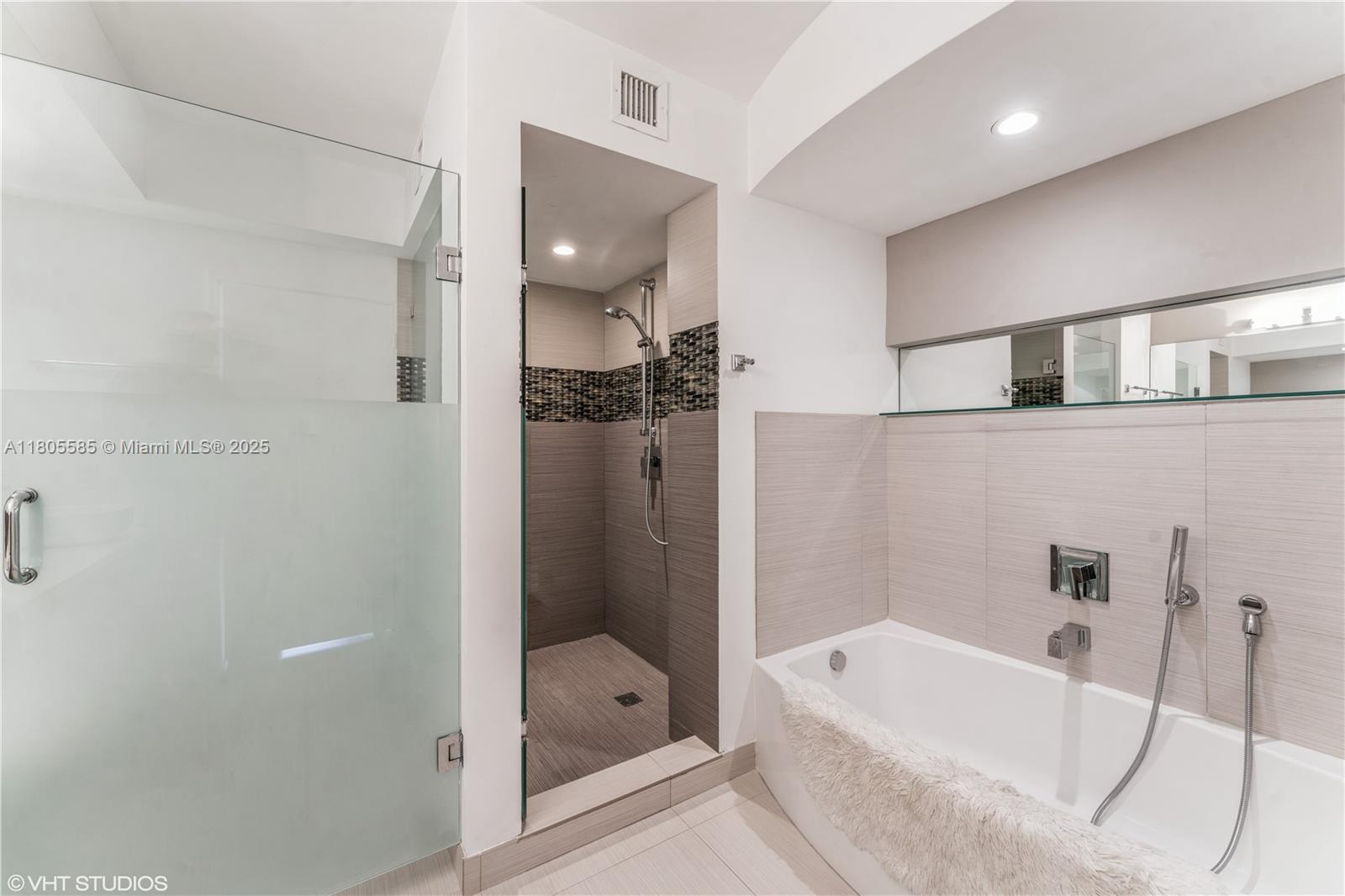 170 Ocean Ln Drive, Unit 906 Key Biscayne, FL 33149 - Photo 16 of 26 a bathroom with a tub a toilet and a shower