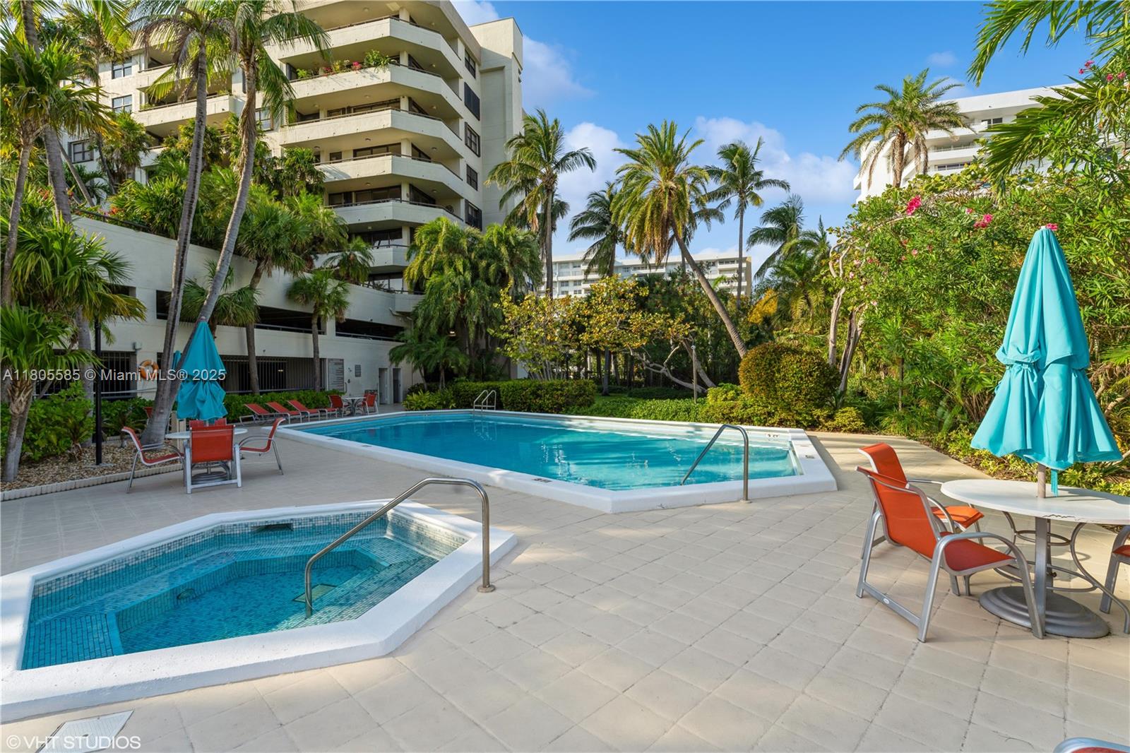 170 Ocean Ln Drive, Unit 906 Key Biscayne, FL 33149 - Photo 2 of 26 a view of backyard with swimming pool and seating space