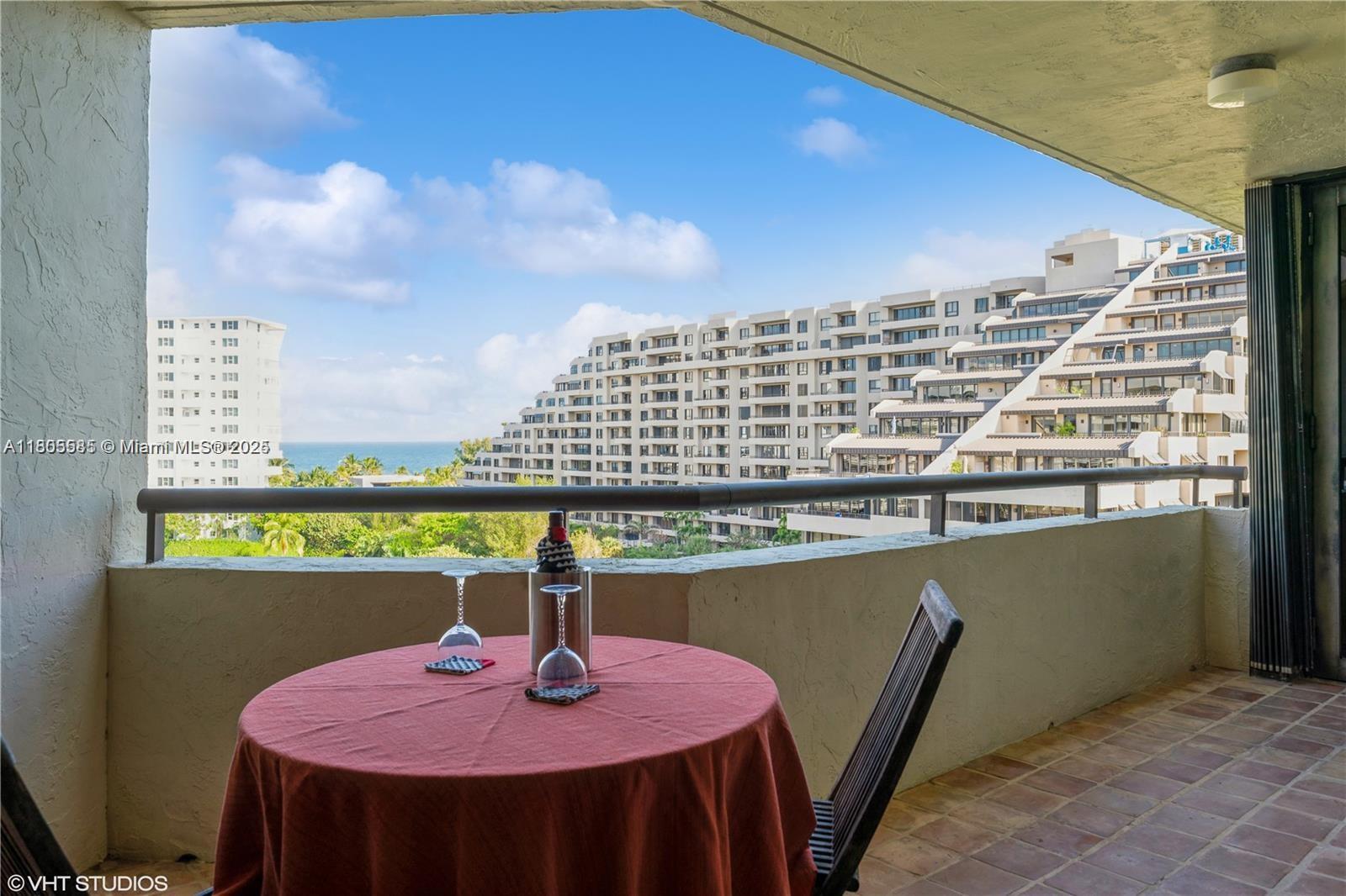 170 Ocean Ln Drive, Unit 906 Key Biscayne, FL 33149 - Photo 3 of 26 a close up of a table with chairs