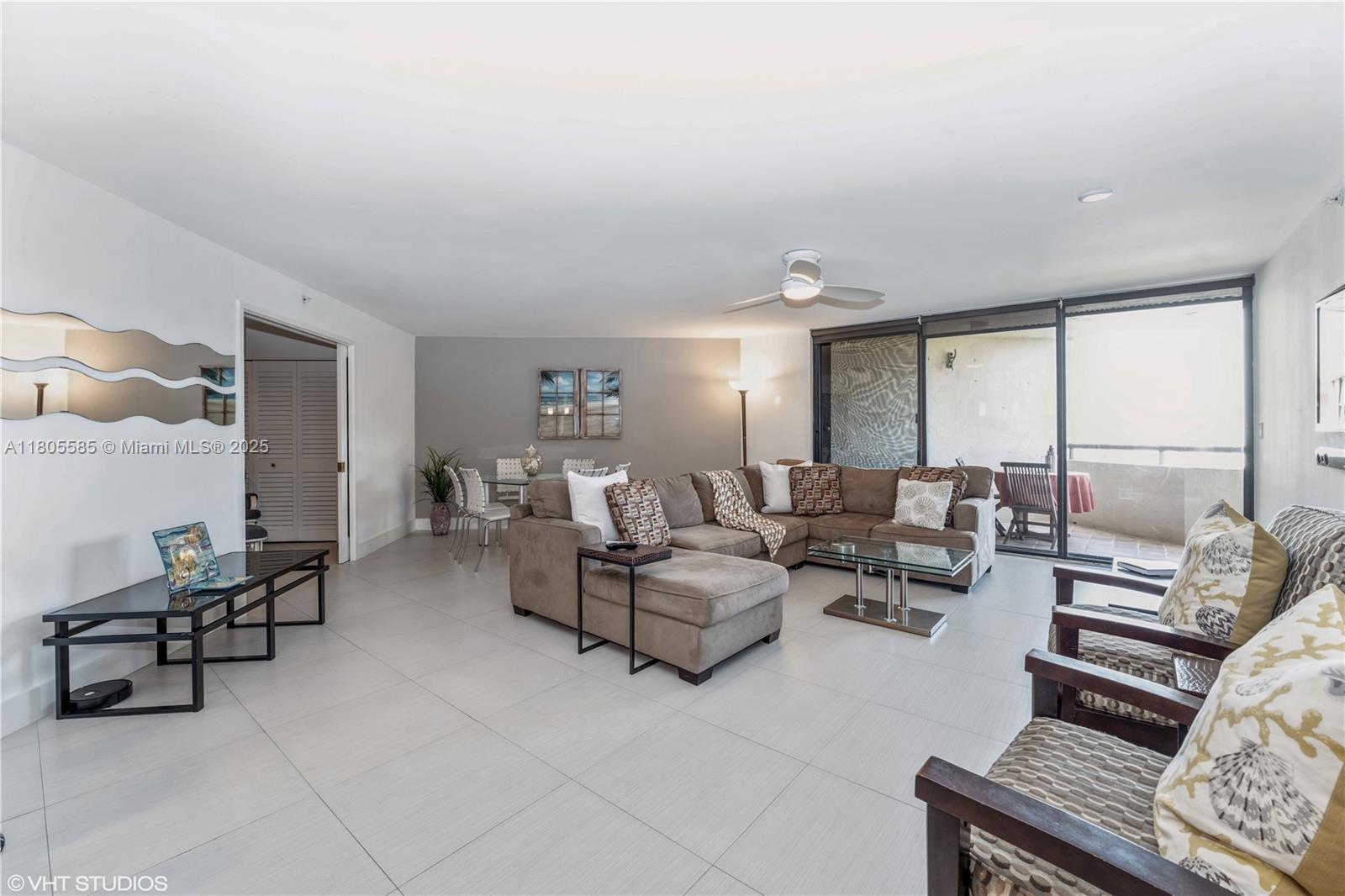 170 Ocean Ln Drive, Unit 906 Key Biscayne, FL 33149 - Photo 7 of 26 a living room with furniture and large windows