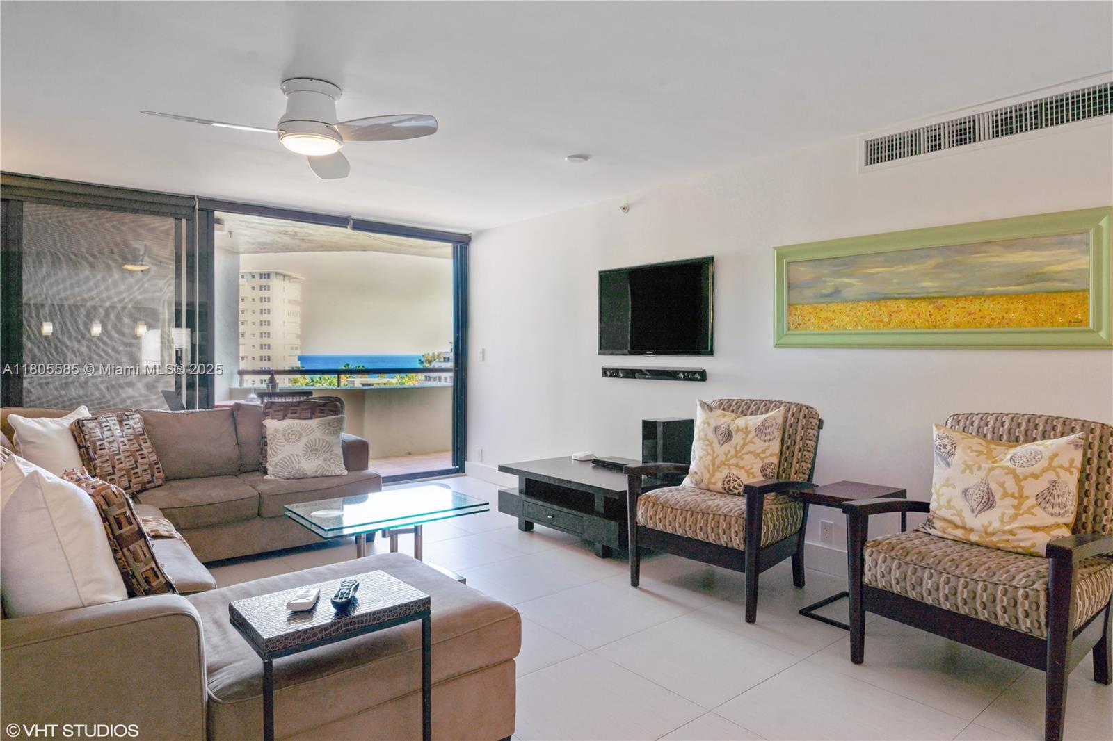 170 Ocean Ln Drive, Unit 906 Key Biscayne, FL 33149 - Photo 9 of 26 a living room with furniture and a flat screen tv