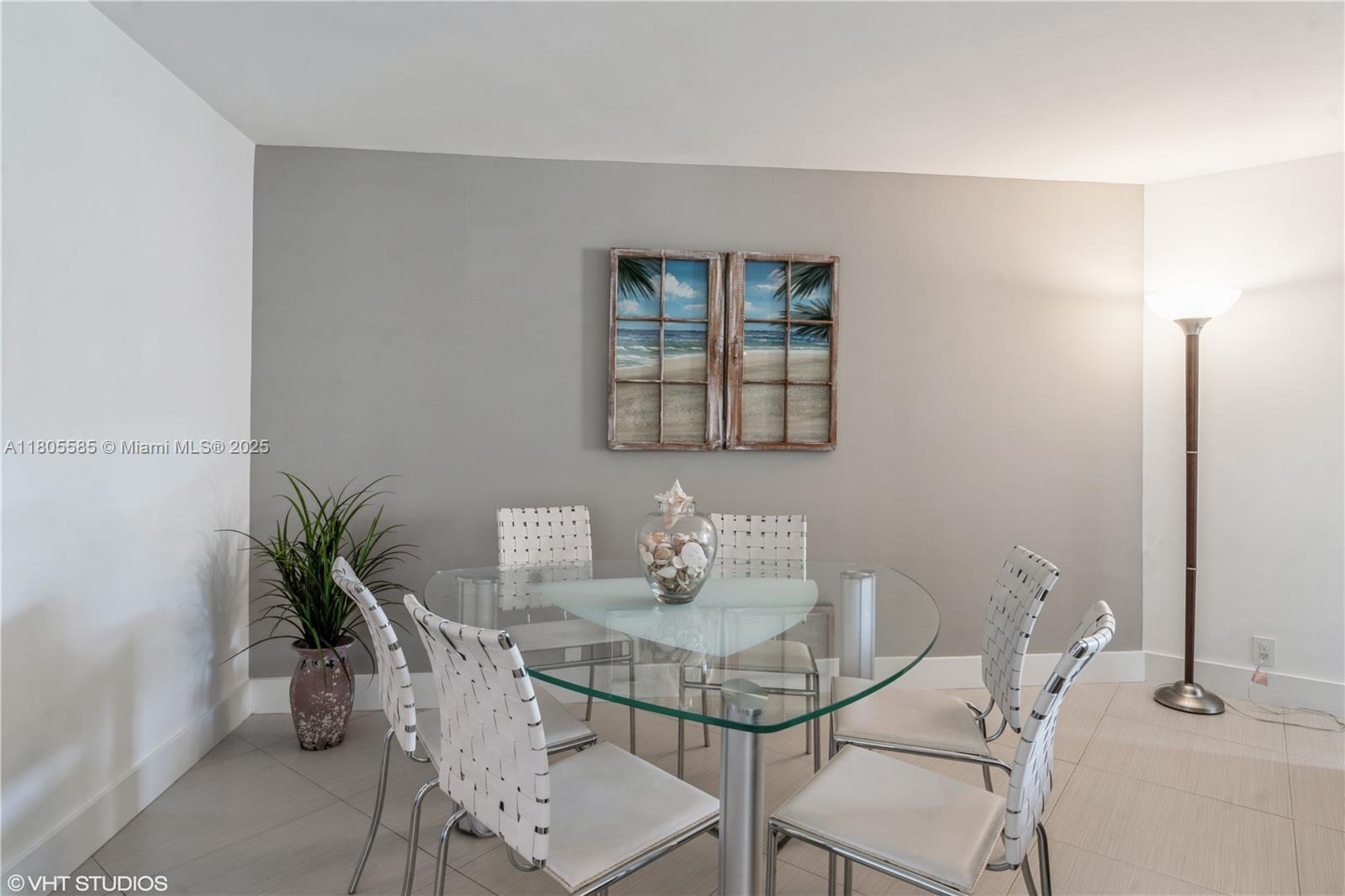 170 Ocean Ln Drive, Unit 906 Key Biscayne, FL 33149 - Photo 10 of 26 a view of a dining room with furniture and a potted plant