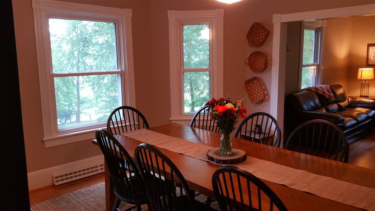 145 Free Mason Run Road Mount Solon, VA 22843 - Photo 12 of 37 a dining room with furniture potted plants and wooden floor