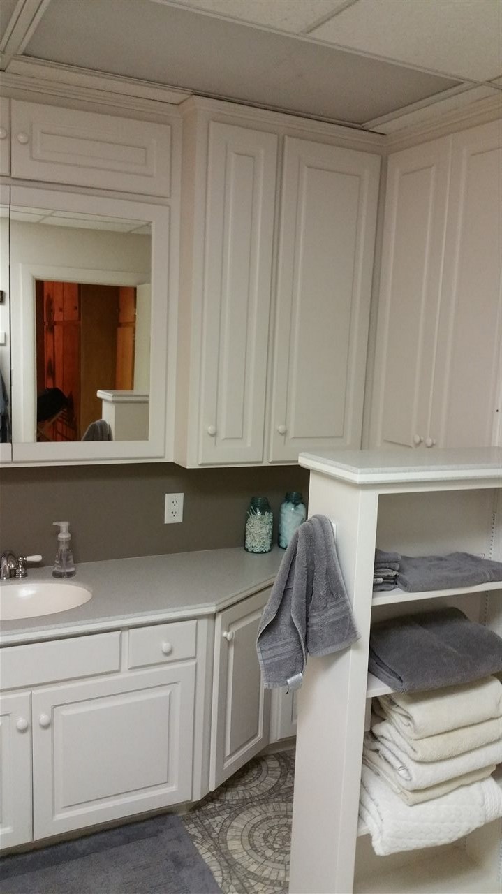145 Free Mason Run Road Mount Solon, VA 22843 - Photo 8 of 37 a kitchen with a white cabinets and a sink