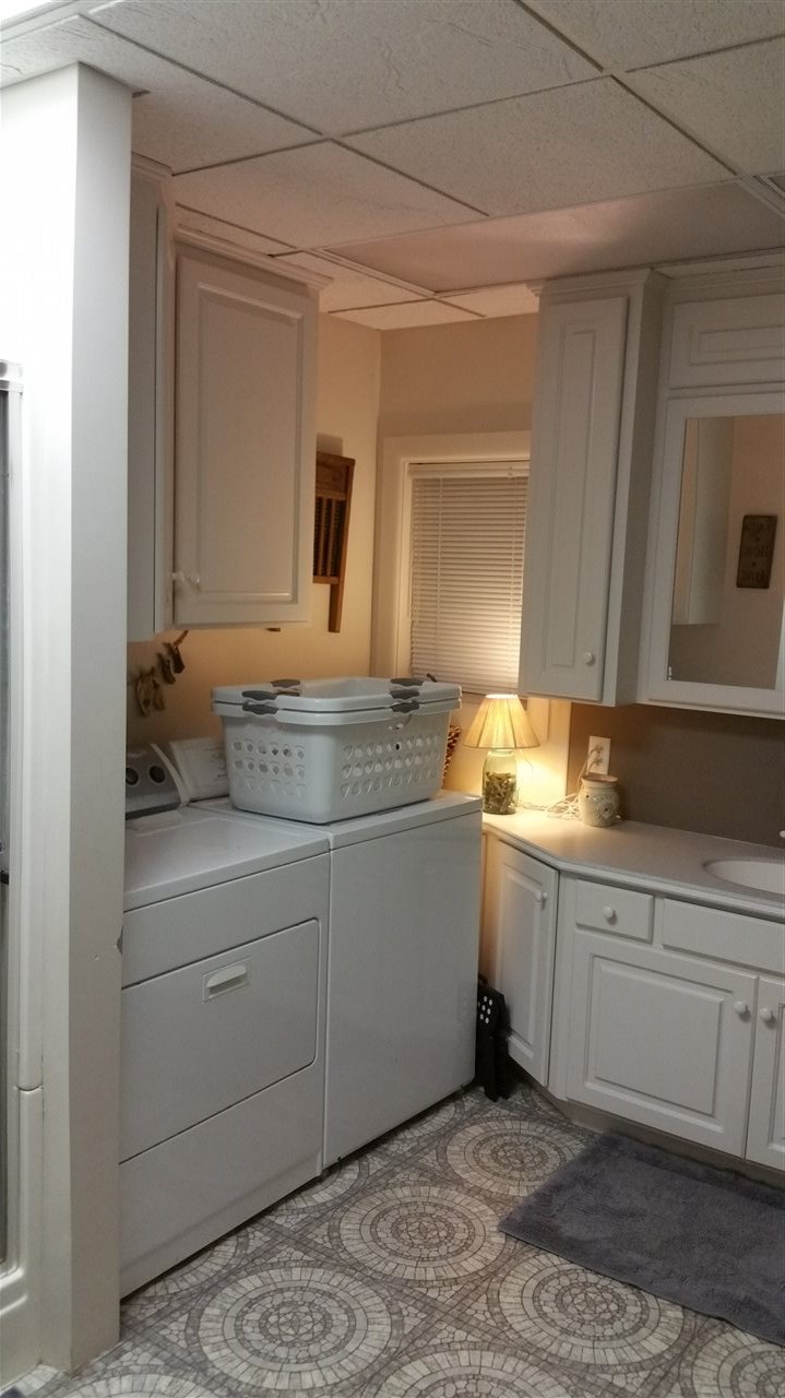 145 Free Mason Run Road Mount Solon, VA 22843 - Photo 9 of 37 a spacious bathroom with a granite countertop sink and a mirror