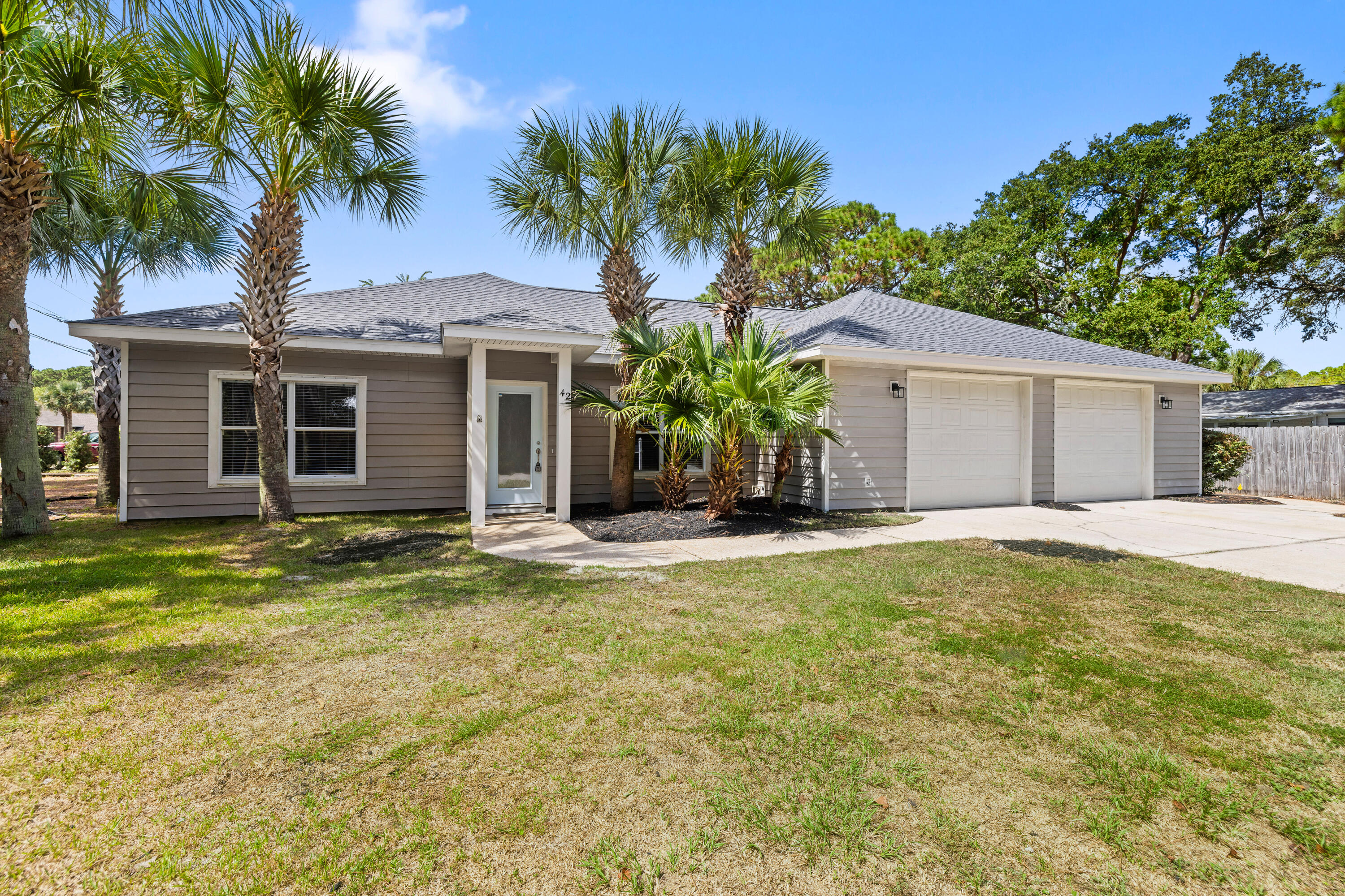 42 Pritchard Road Miramar Beach, FL 32550 - Photo 1 of 51 a front view of house with yard and trees in the background