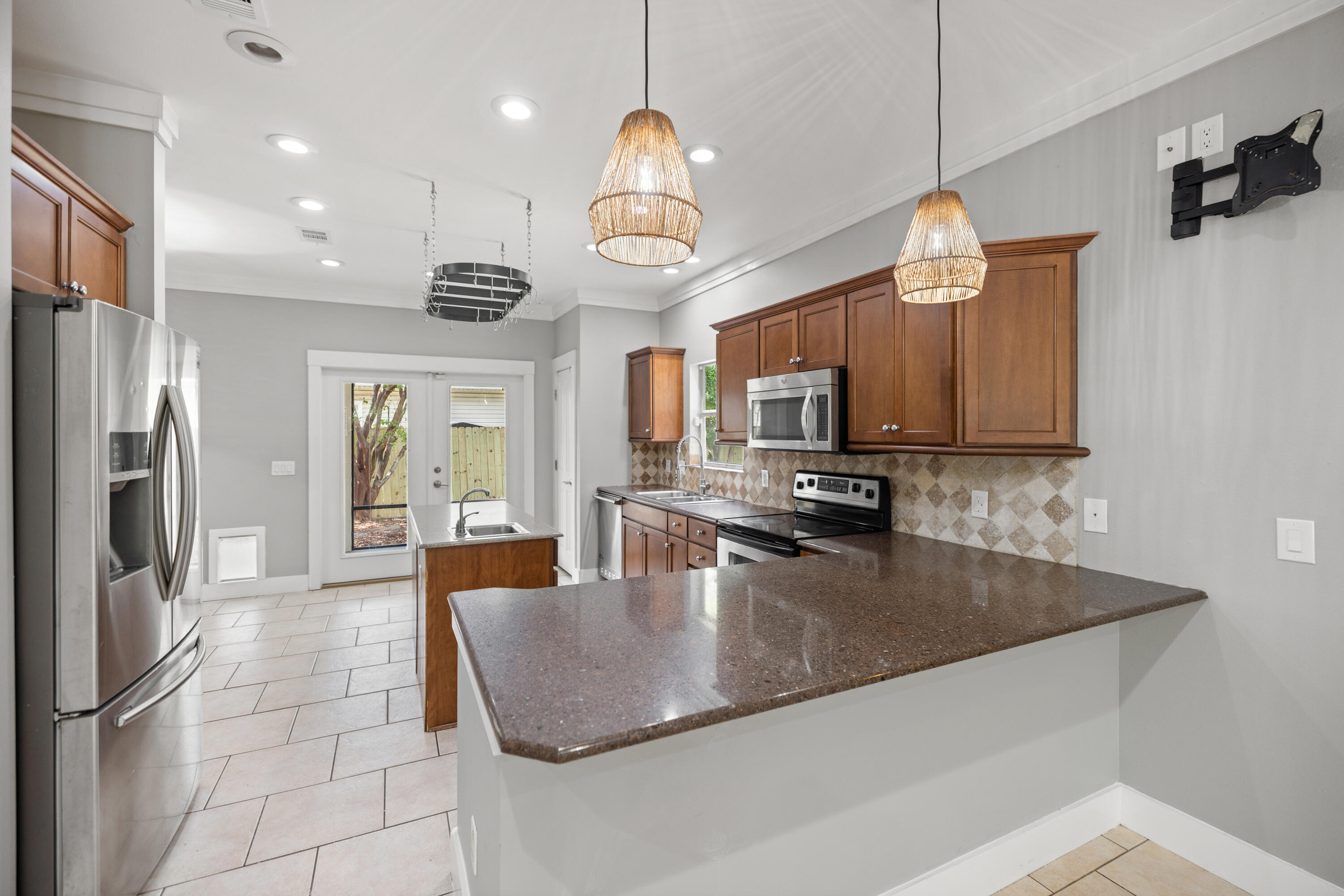42 Pritchard Road Miramar Beach, FL 32550 - Photo 11 of 51 a large kitchen with stainless steel appliances granite countertop a sink a stove and a refrigerator