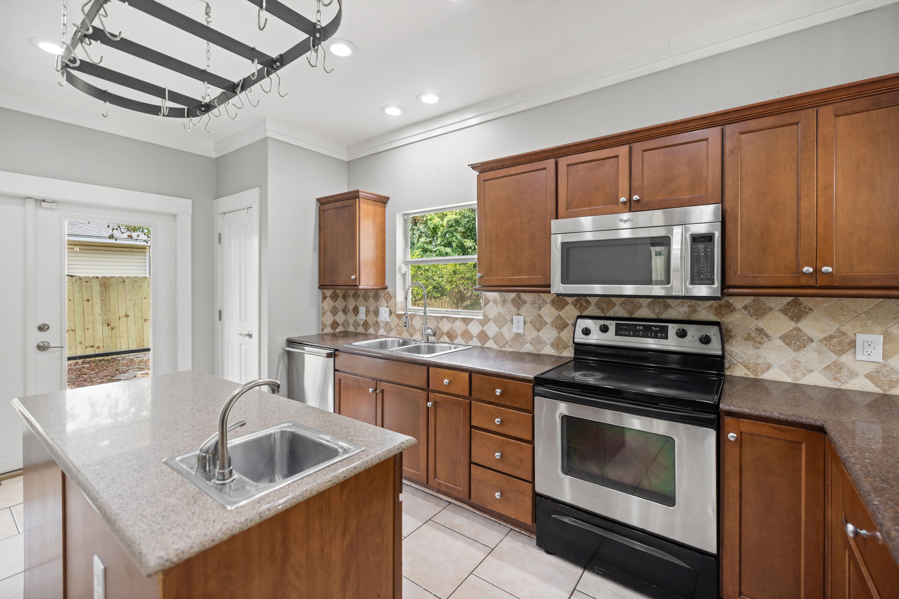 42 Pritchard Road Miramar Beach, FL 32550 - Photo 13 of 51 a kitchen with sink cabinets and stainless steel appliances