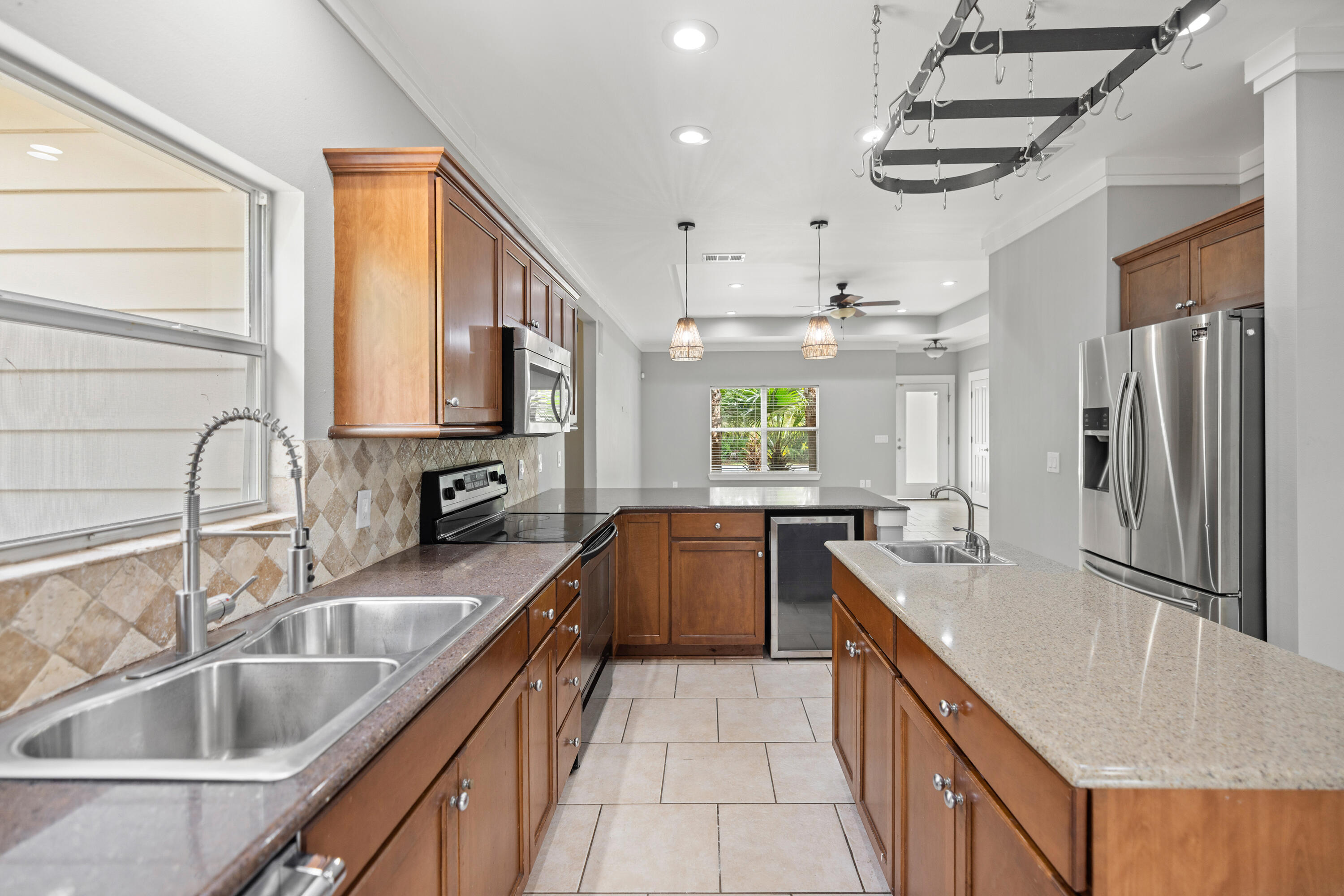 42 Pritchard Road Miramar Beach, FL 32550 - Photo 14 of 51 a kitchen with granite countertop a sink stove and refrigerator
