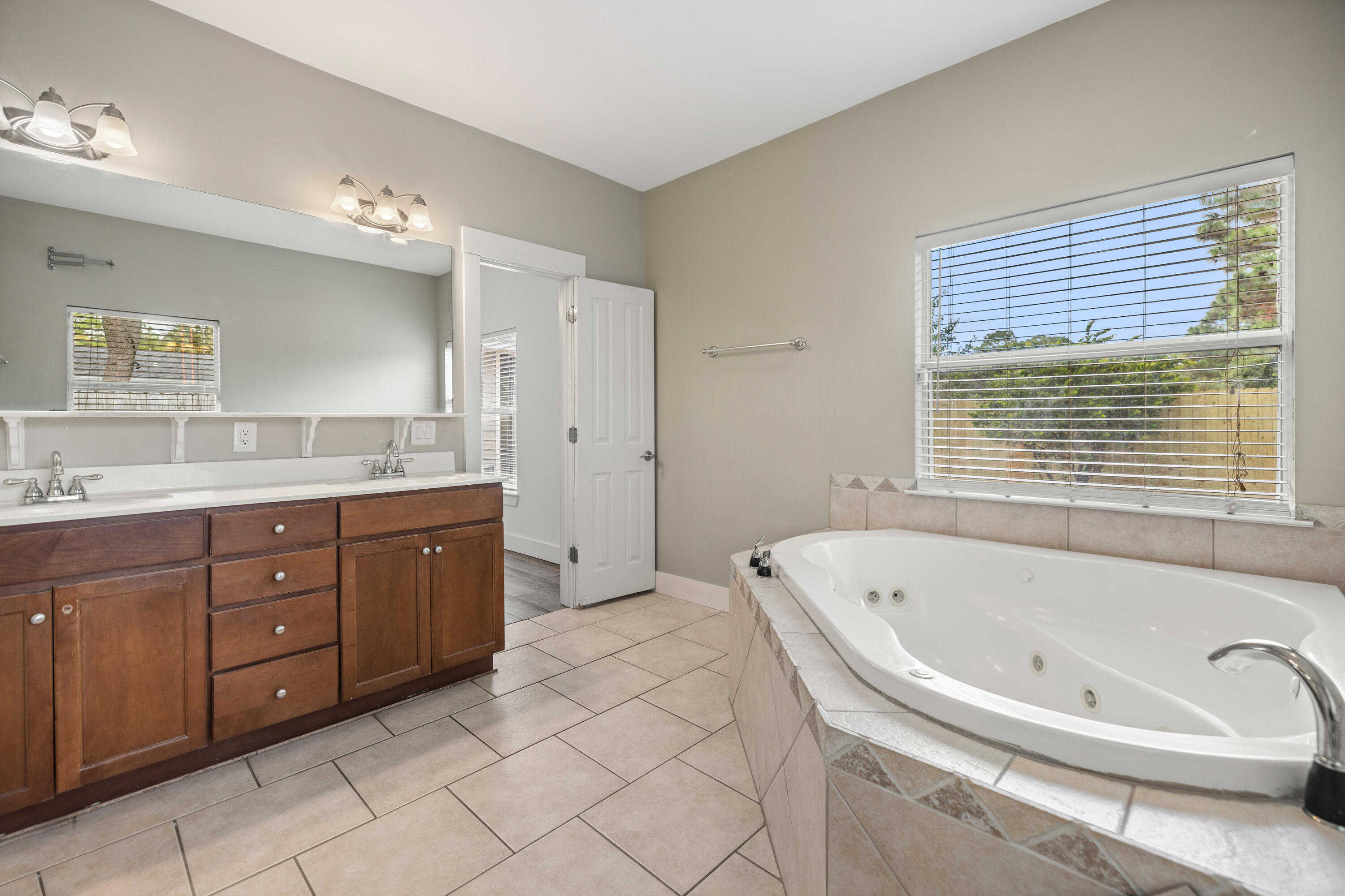 42 Pritchard Road Miramar Beach, FL 32550 - Photo 22 of 51 a spacious bathroom with a tub sink and mirror