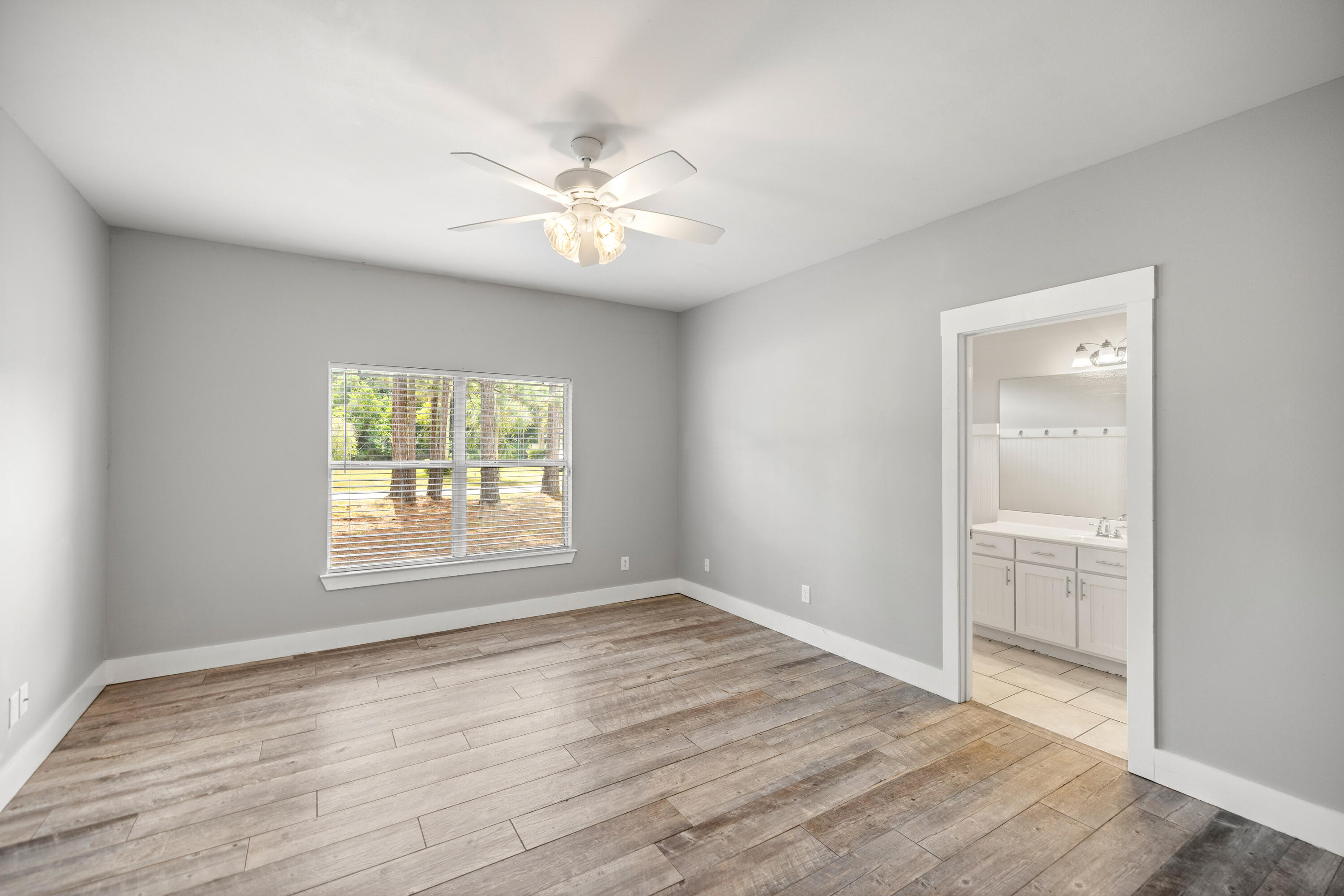 42 Pritchard Road Miramar Beach, FL 32550 - Photo 29 of 51 a view of an empty room with wooden floor and a window