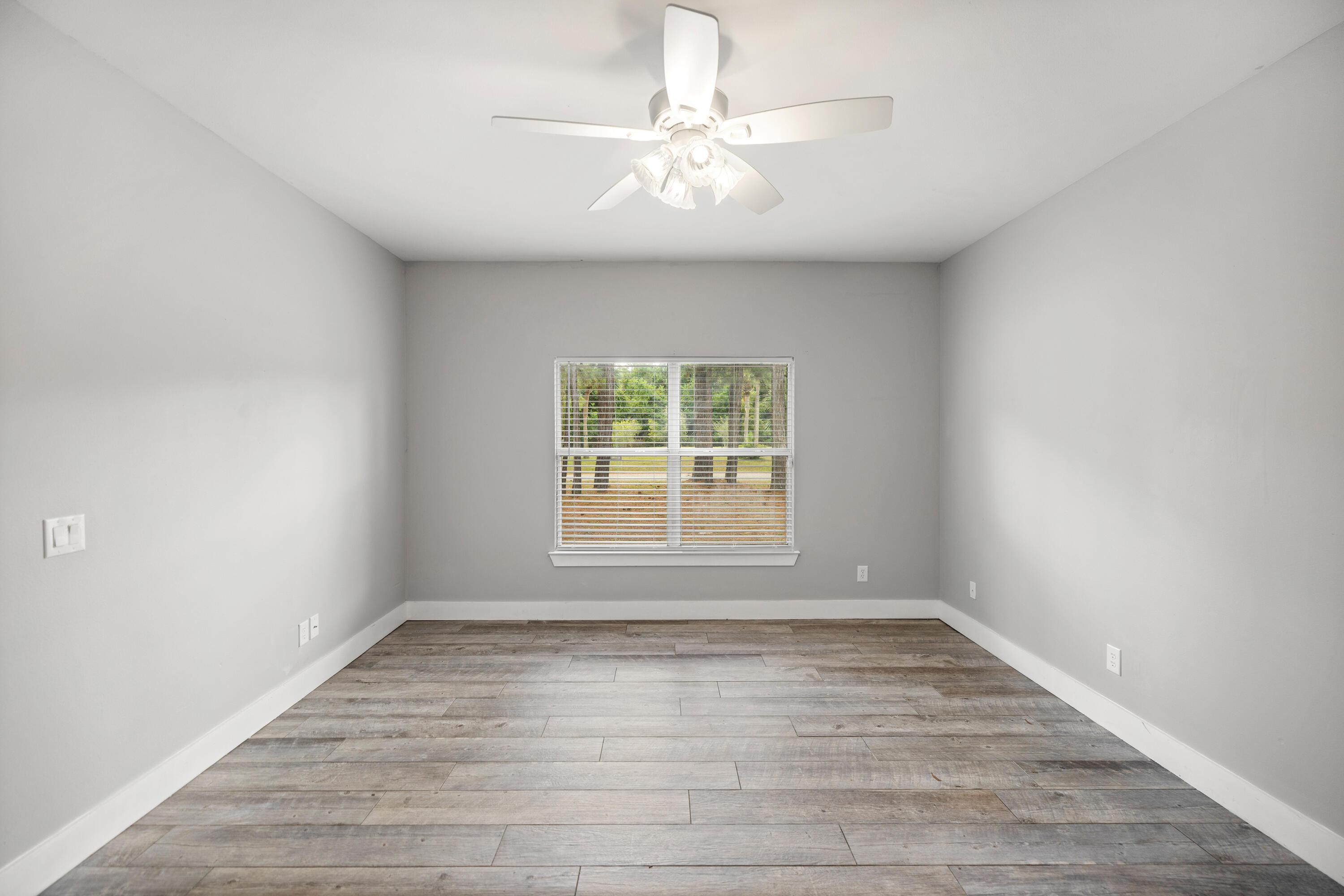42 Pritchard Road Miramar Beach, FL 32550 - Photo 30 of 51 wooden floor in an empty room with a window