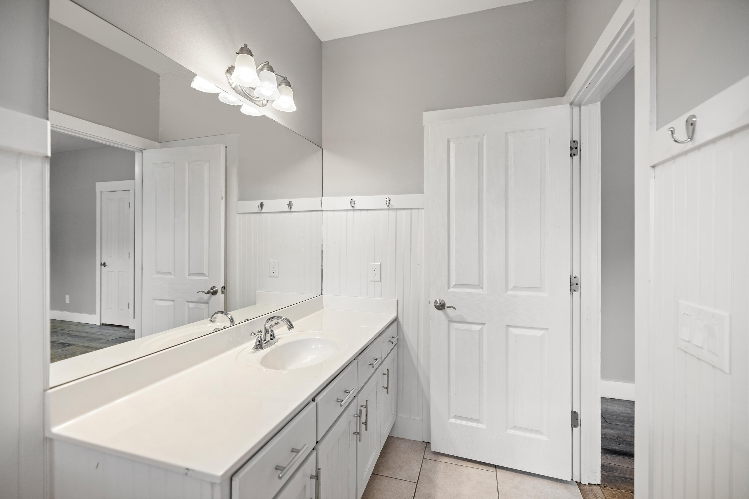 42 Pritchard Road Miramar Beach, FL 32550 - Photo 34 of 51 a bathroom with a double vanity sink and a mirror
