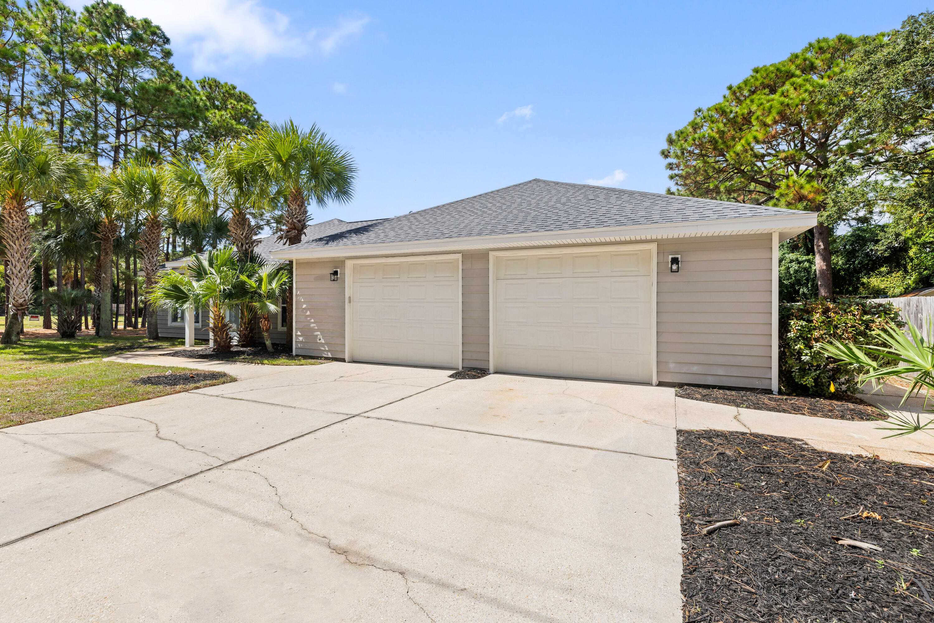 42 Pritchard Road Miramar Beach, FL 32550 - Photo 38 of 51 a front view of a house with a yard and garage