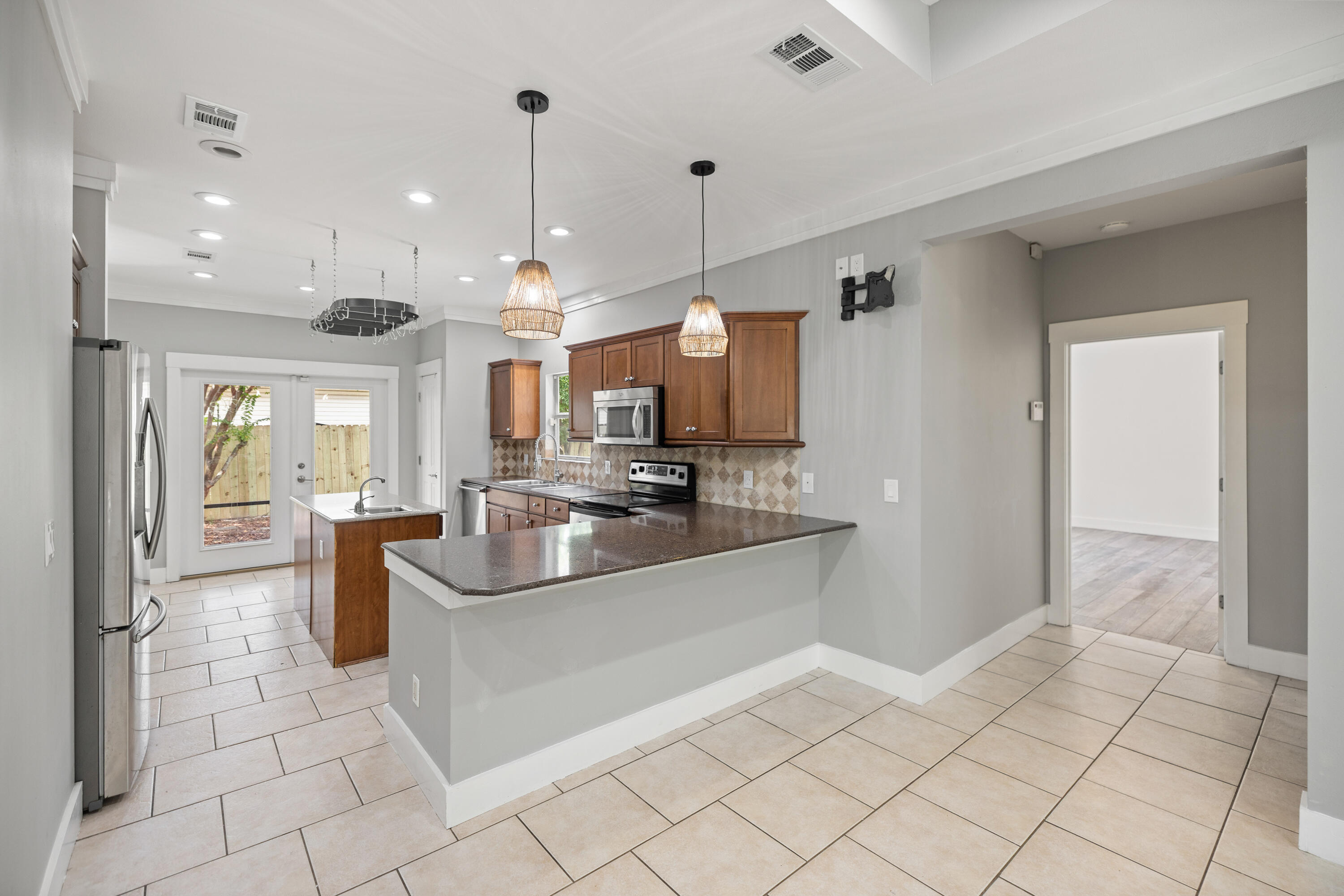 42 Pritchard Road Miramar Beach, FL 32550 - Photo 10 of 51 a large kitchen with stainless steel appliances a sink and cabinets