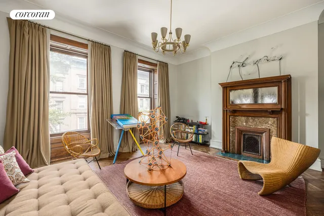 a outdoor sitting area with furniture and wooden floor