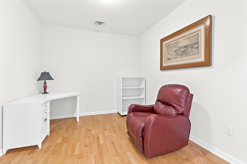 36 Abigail Way, Unit 3003 Reading, MA 01867 - Photo 12 of 42 a living room with furniture and wooden floor