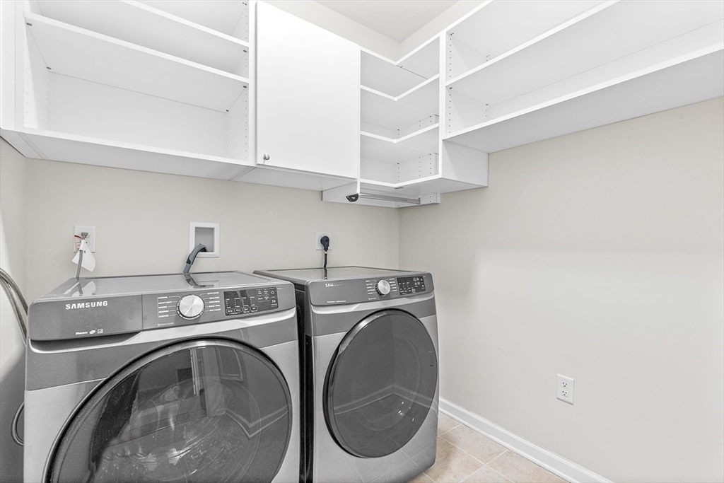 36 Abigail Way, Unit 3003 Reading, MA 01867 - Photo 14 of 42 a utility room with dryer and washer