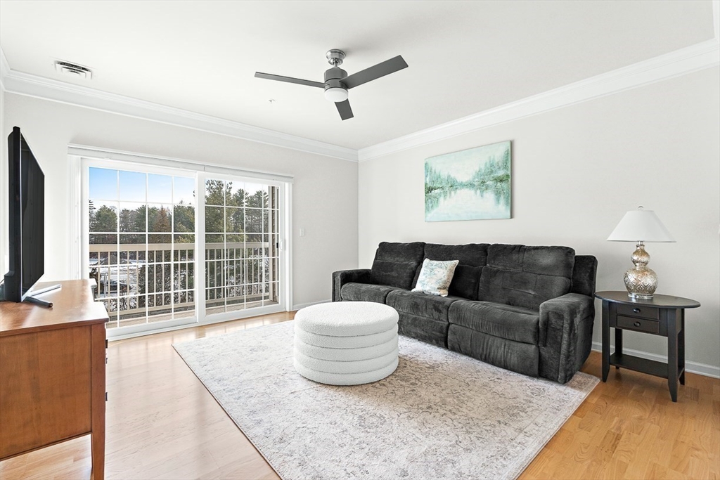 36 Abigail Way, Unit 3003 Reading, MA 01867 - Photo 22 of 42 a living room with furniture and a large window