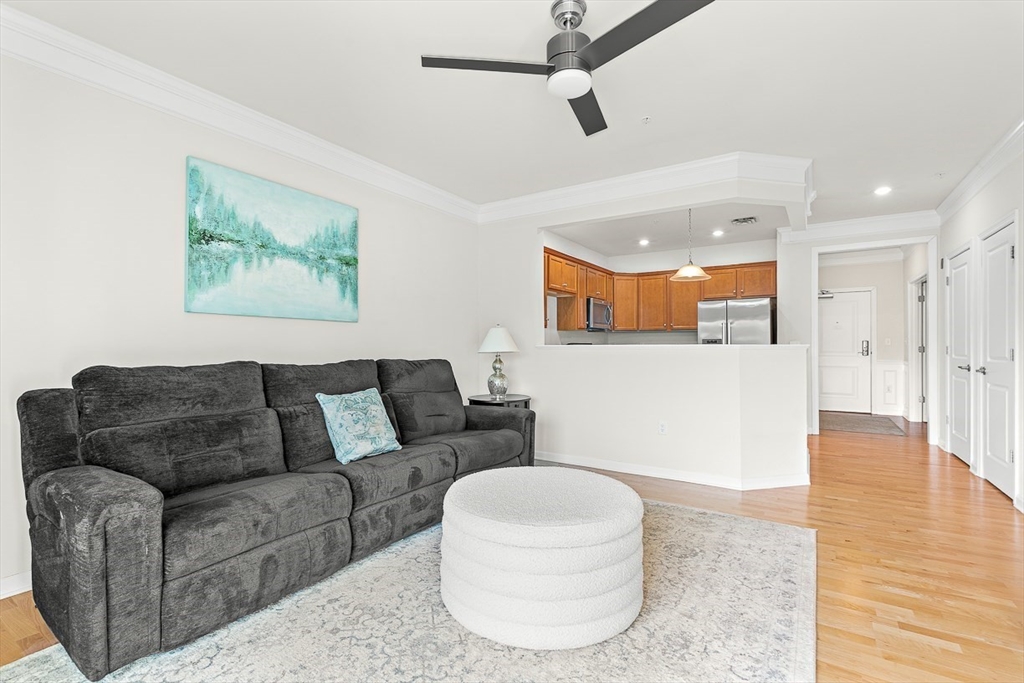 36 Abigail Way, Unit 3003 Reading, MA 01867 - Photo 23 of 42 a living room with furniture and a wooden floor