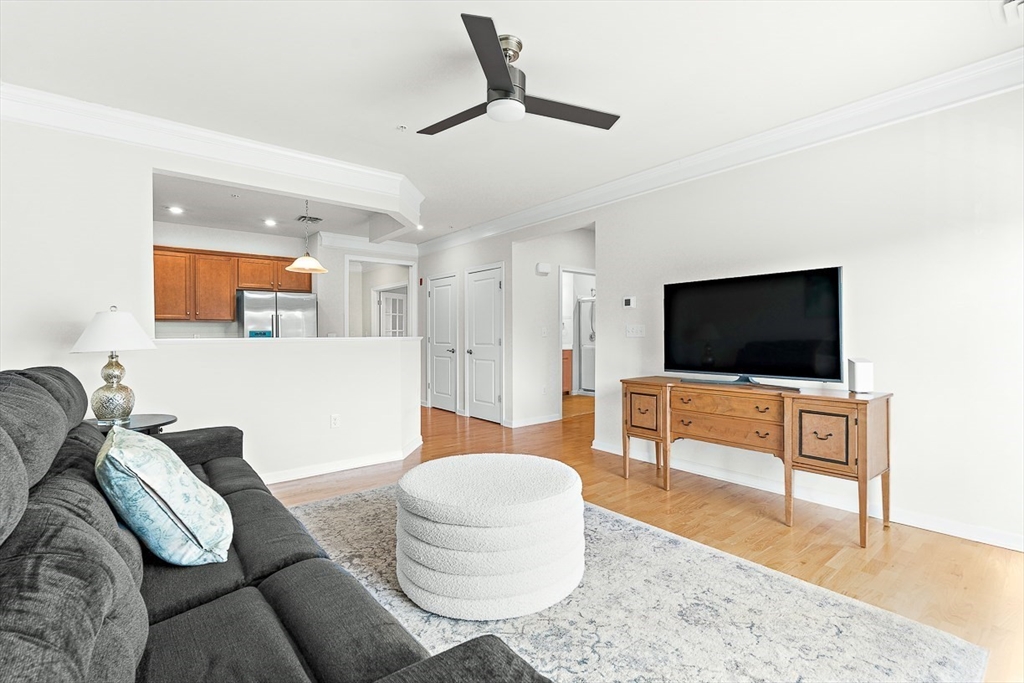 36 Abigail Way, Unit 3003 Reading, MA 01867 - Photo 24 of 42 a living room with furniture and a flat screen tv