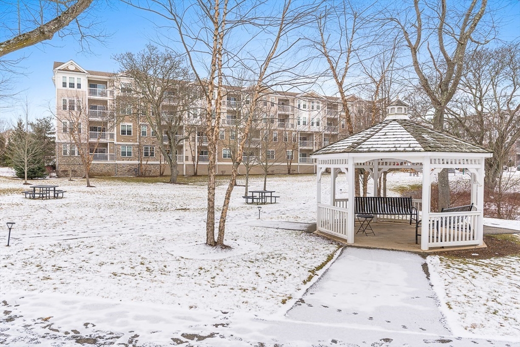 36 Abigail Way, Unit 3003 Reading, MA 01867 - Photo 39 of 42 a front view of a building with a porch