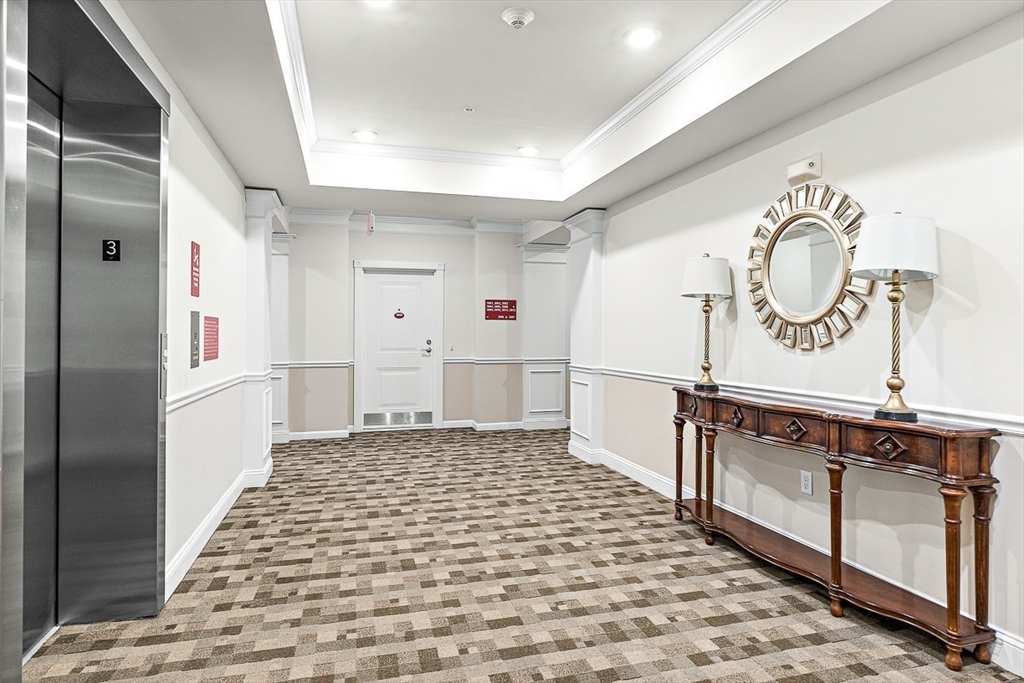 36 Abigail Way, Unit 3003 Reading, MA 01867 - Photo 8 of 42 a bathroom with a sink and a mirror