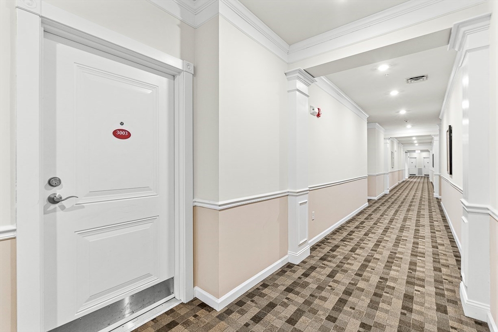36 Abigail Way, Unit 3003 Reading, MA 01867 - Photo 9 of 42 a view of entryway with wooden floor