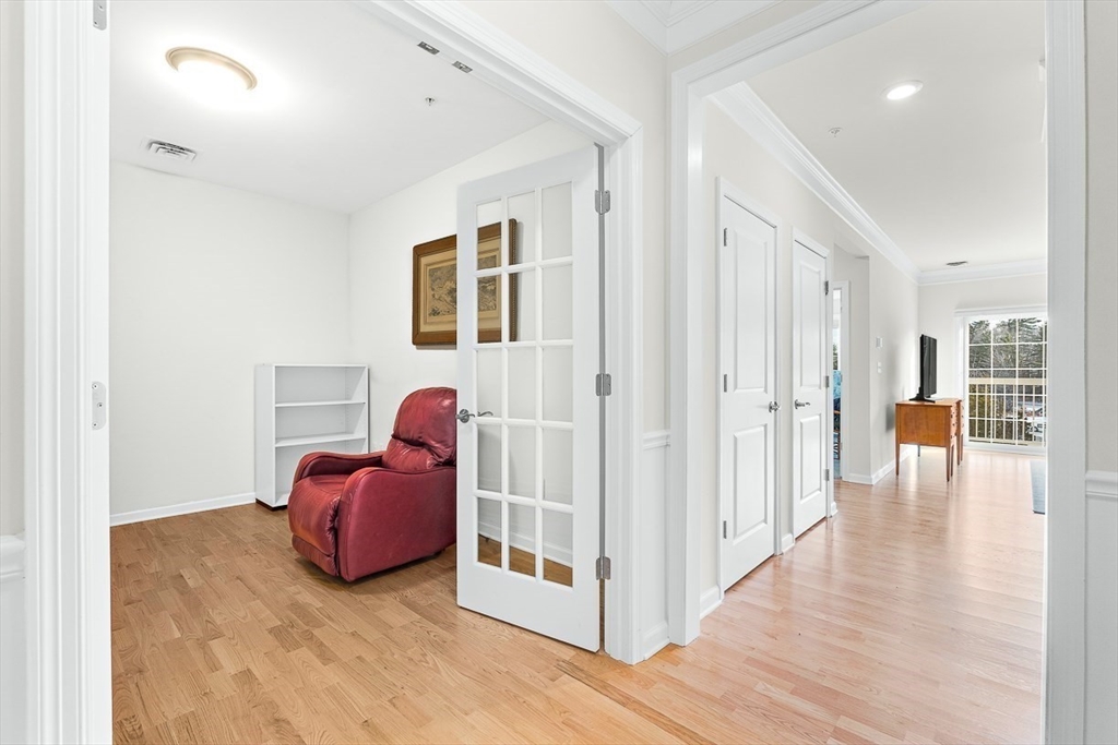 36 Abigail Way, Unit 3003 Reading, MA 01867 - Photo 10 of 42 a view of a livingroom with furniture and wooden floor